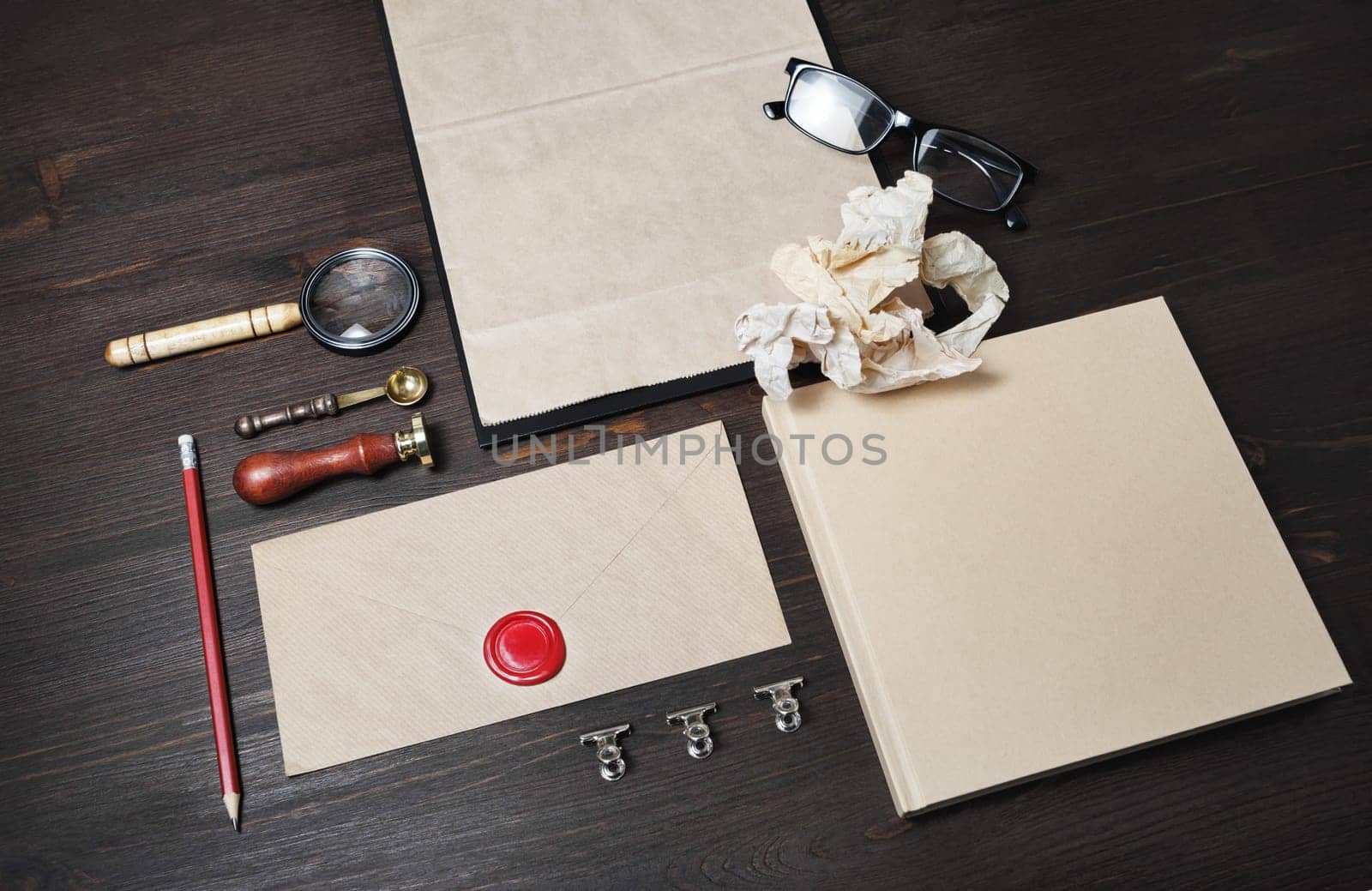 Blank kraft stationery set on wood table background. Corporate identity template. Mock-up for branding identity for designers.