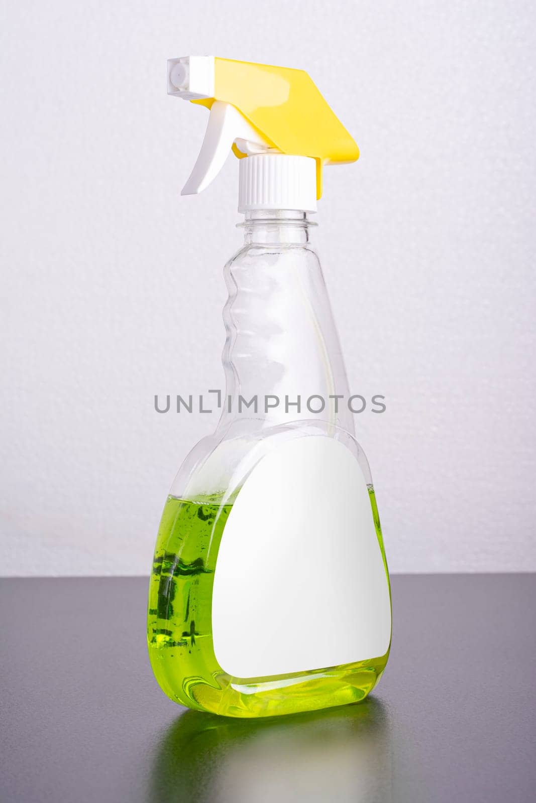 Cleaning liquid bottle in front of  light gray background, editable mock-up series template ready for your design, selection path included.