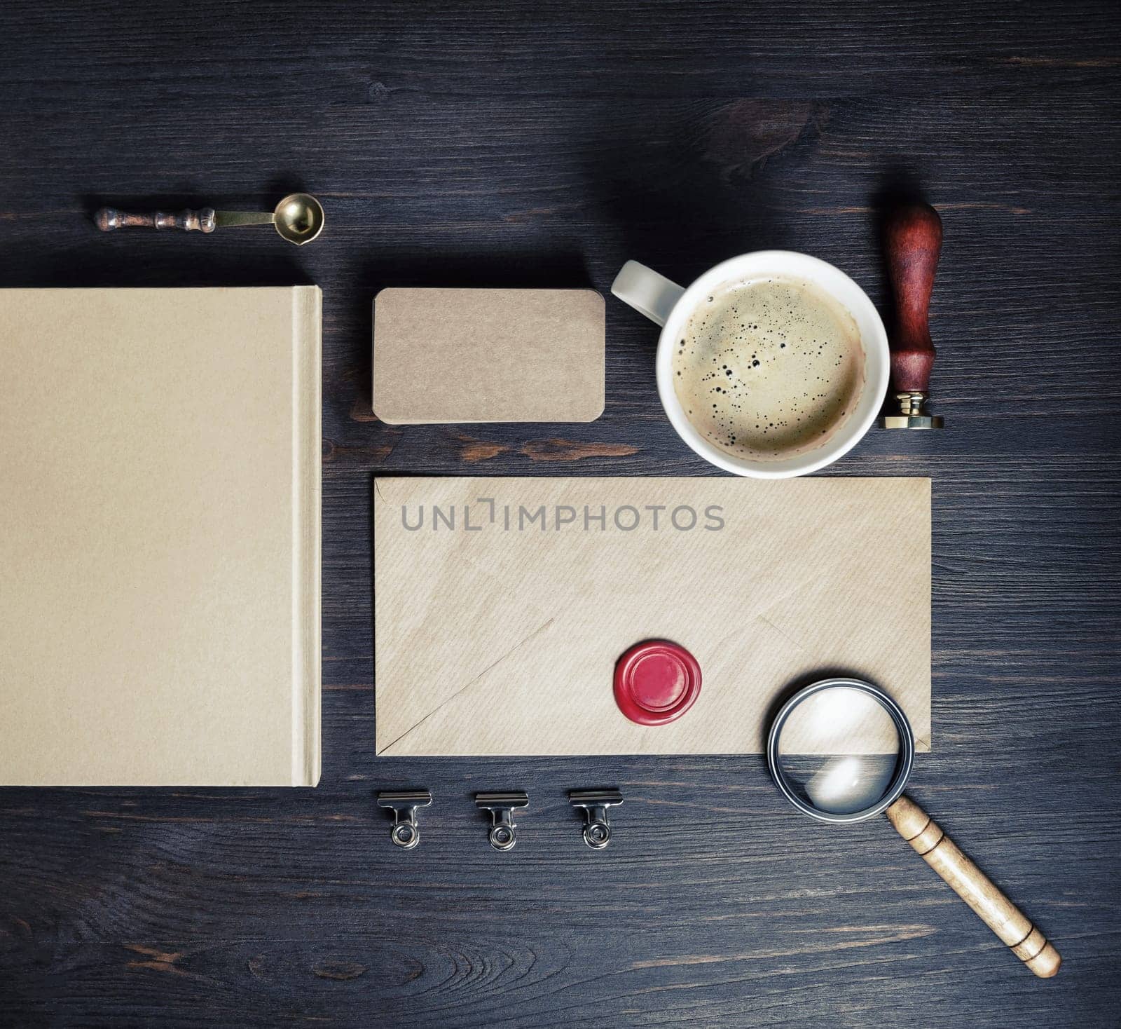 Blank vintage envelope and retro stationery on wood table background. Top view. Flat lay.