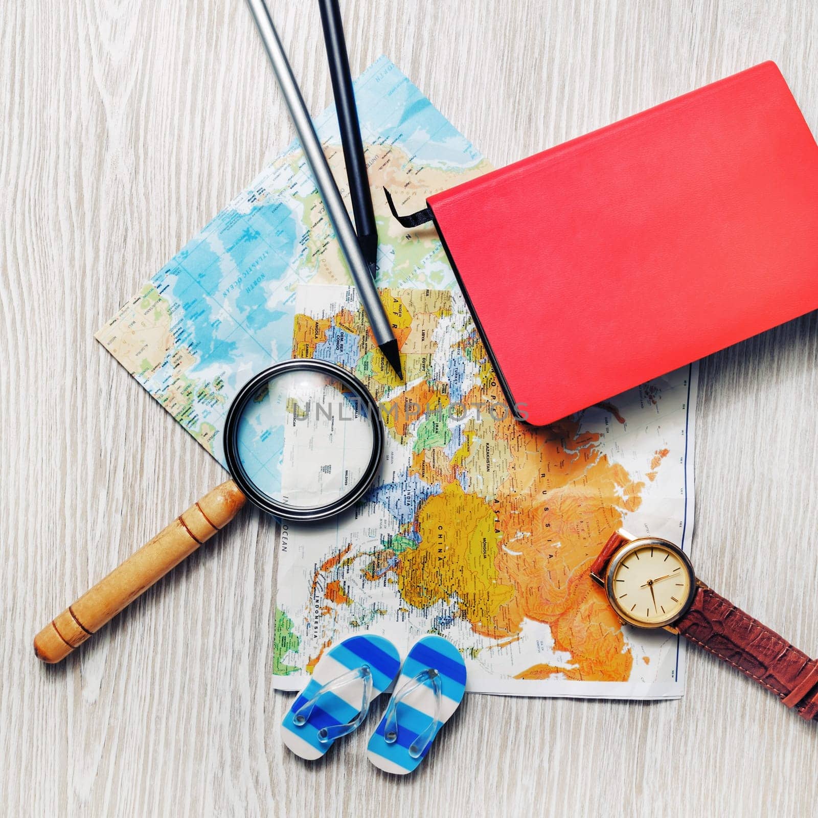 Travel planning concept. Overhead view of traveler accessories. Flat lay.