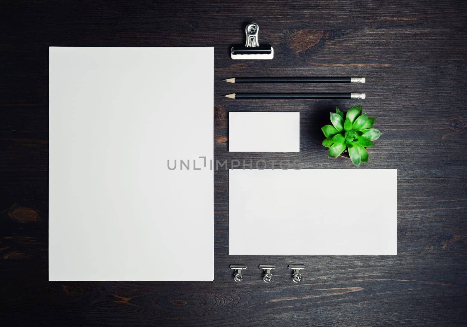 Stationery mock up on wooden background. Responsive design template. Branding identity mock up. Top view. Flat lay.