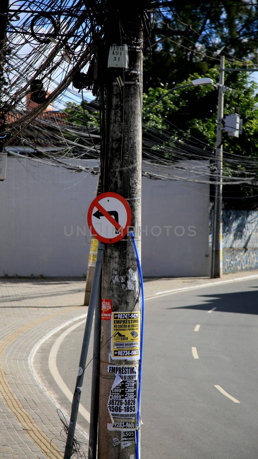 salvador, bahia / brazil - july 4, 2020: traffic signs indicate forbidden to turn left, seen on a pole connected to the electricity grid in the Cabula neighborhood, in the city of Salvador.....