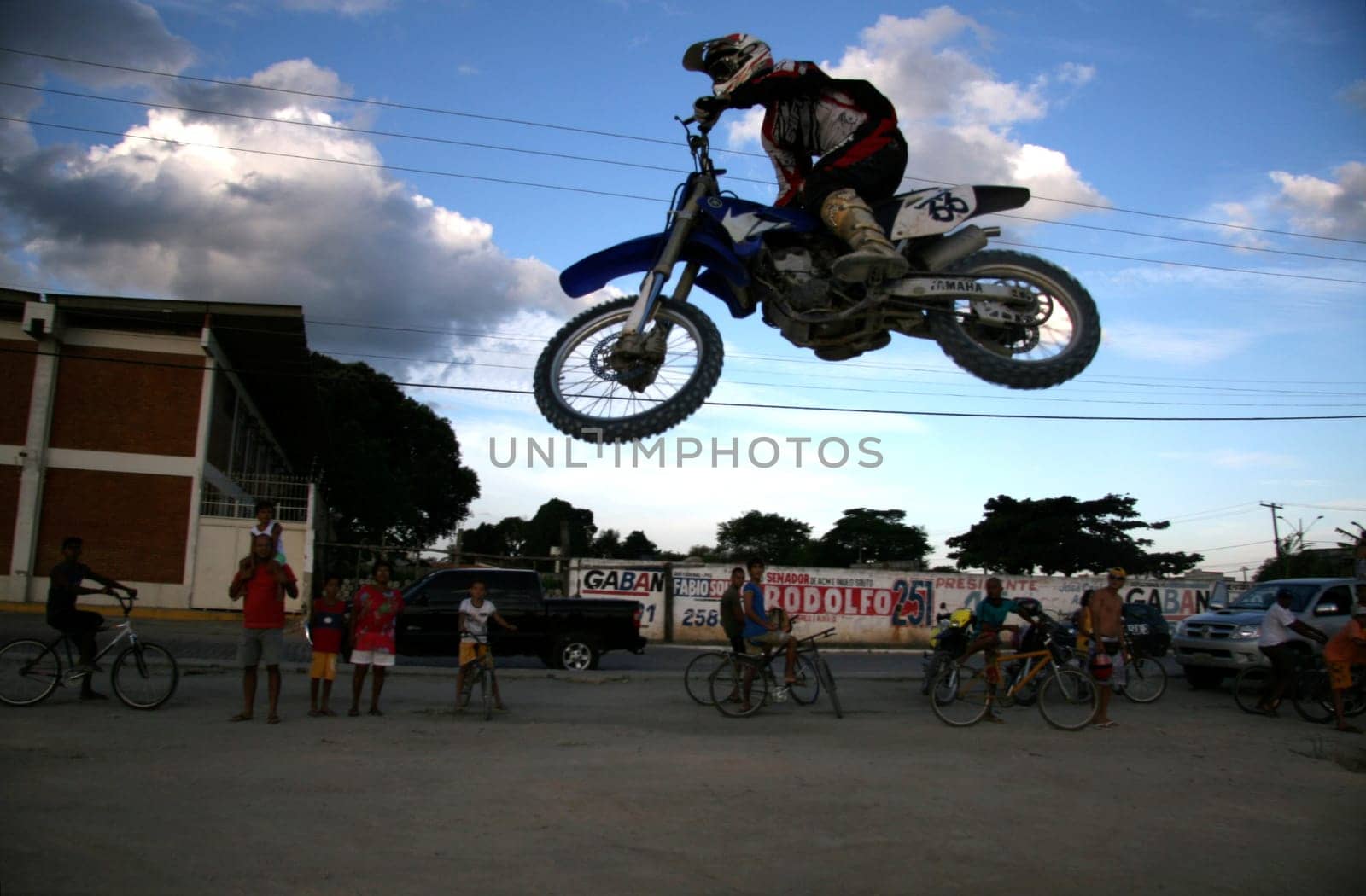 eunapolis, bahia / brazil - june 13, 2008: biker jumps with a motorcycle during motocross training in the city of Eunapolis.