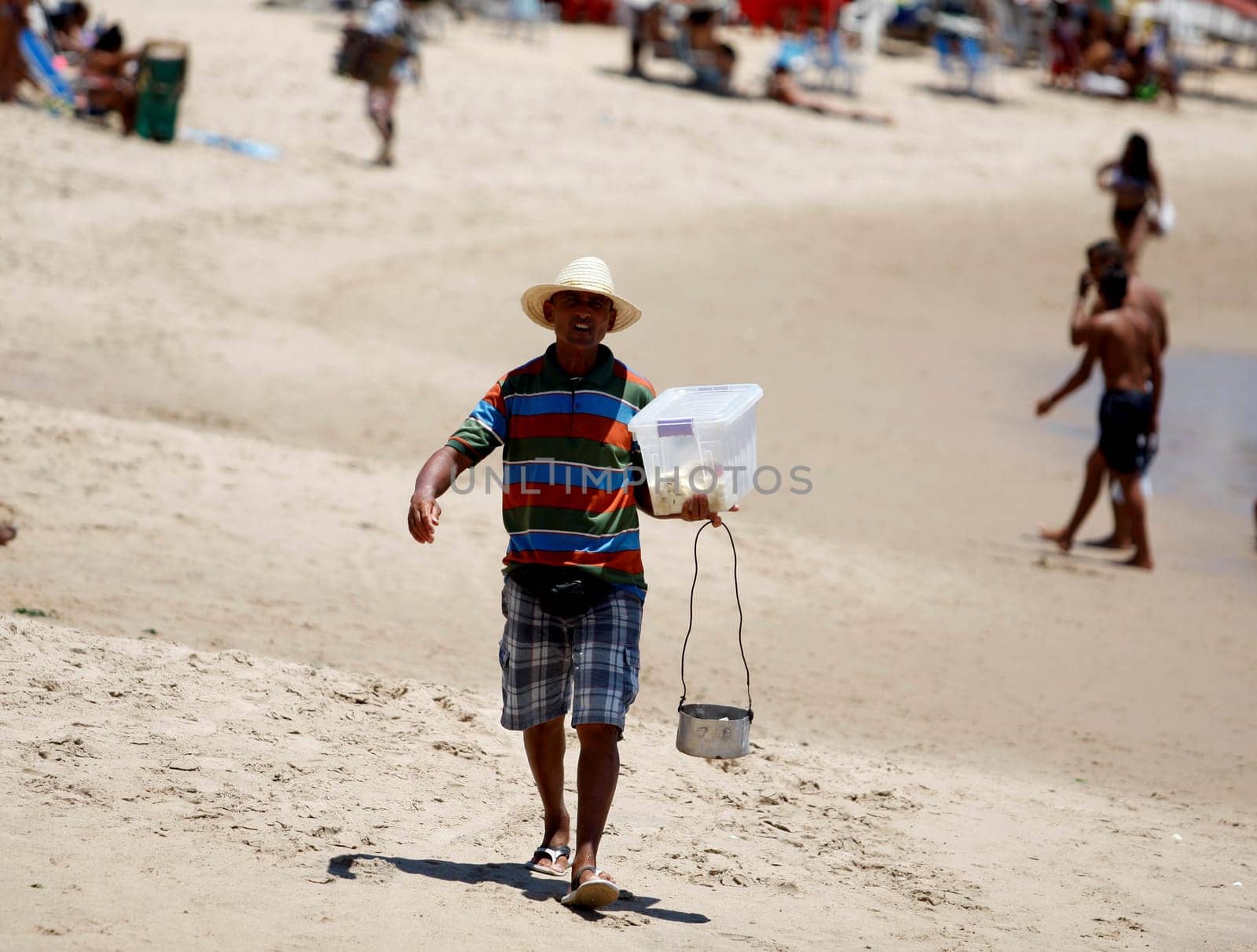 salvador, bahia / brazil - december 30, 2015: Street vendor is seen at Praia do Flamengo in the city of Salvador.