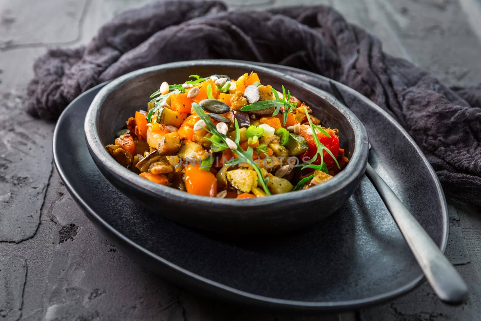 Low carb salad of grilled vegetables with rocket (arugula) and seeds