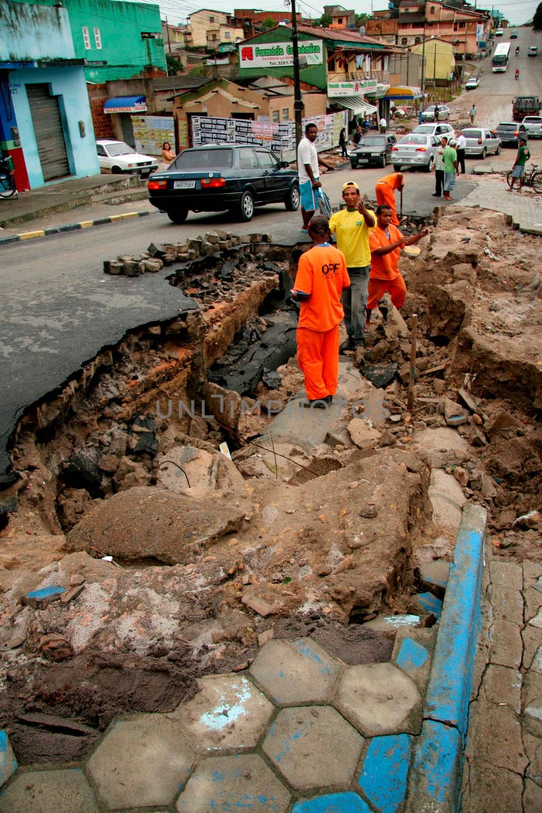 eunapolis, bahia / brazil - june 3, 2009: workers are seen recovering runway destroyed by rain that fell in the city of Eunapolis.