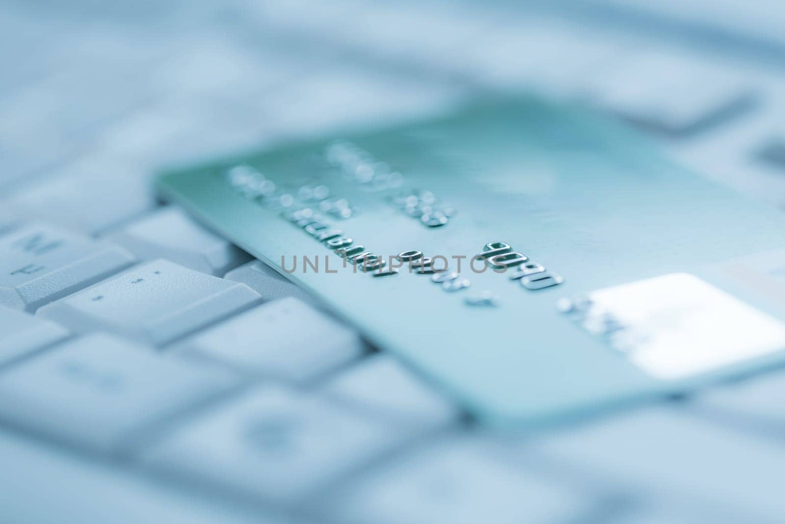 Bank creadit card on keyboard. Concept of online banking and internet purchase. Soft focus.