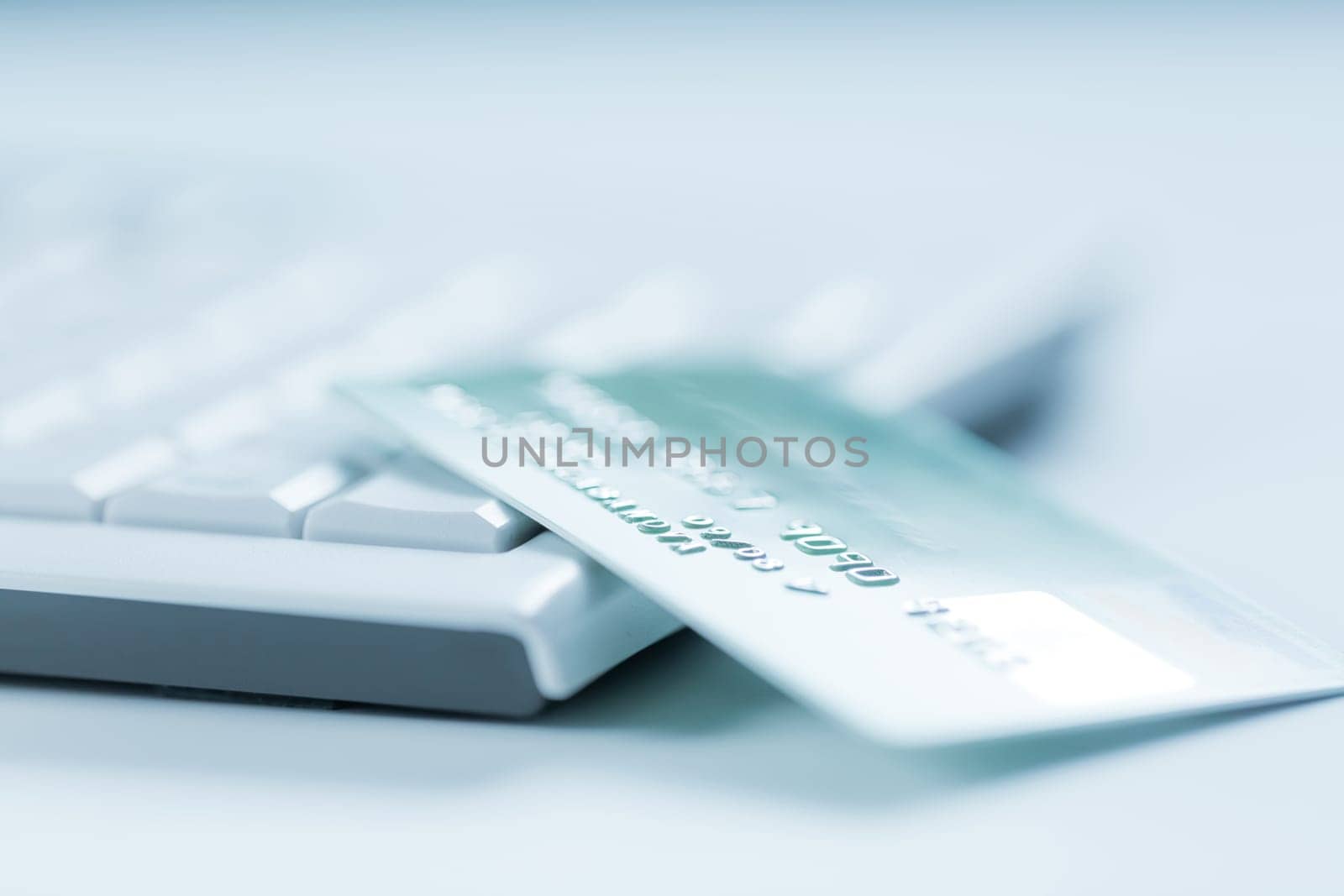 Bank creadit card on keyboard. Concept of online banking and internet purchase. Soft focus.