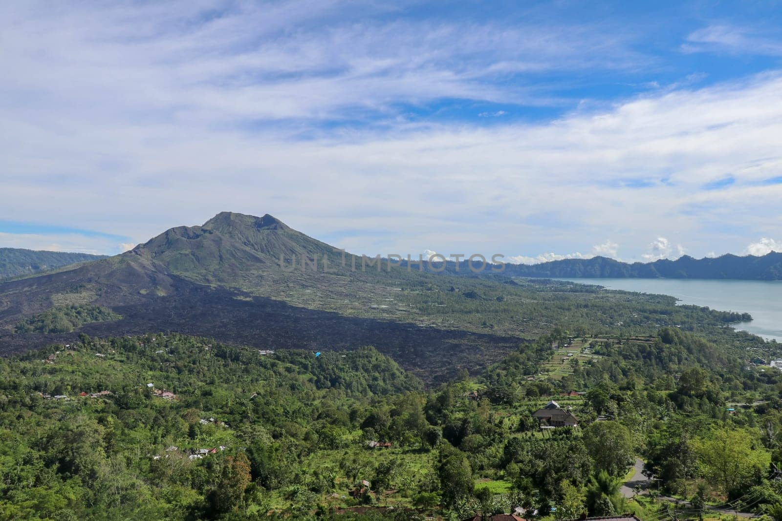 Panoramic indonesian landscape tropical island bali. Popular tourist attractions of Bali tropical island, amazing top view on Batur Indonesia. Batur lake and volcano are in the central mountains.