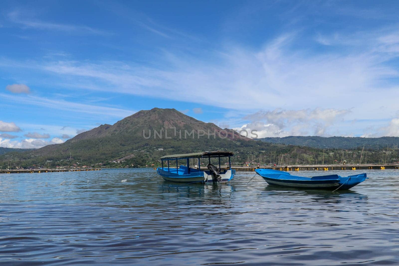 Panoramic indonesian landscape tropical island bali. Popular tourist attractions of Bali tropical island, amazing top view on Batur Indonesia. Batur lake and volcano are in the central mountains.