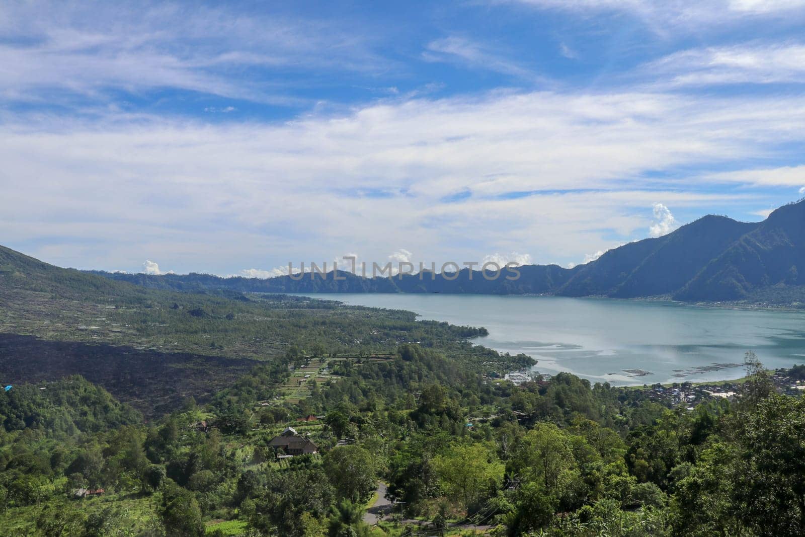 Panoramic indonesian landscape tropical island bali. Popular tourist attractions of Bali tropical island, amazing top view on Batur Indonesia. Batur lake and volcano are in the central mountains.