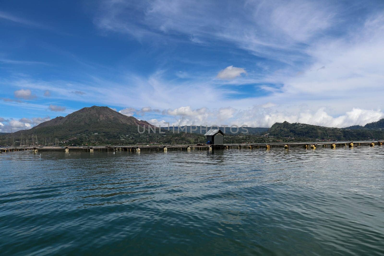 Batur volcano on Bali island, Indonesia. Active Indonesian Volcano Batur in the tropical island. Batur lake and volcano are in the central mountains of Bali near the Kintamani village, Indonesia.