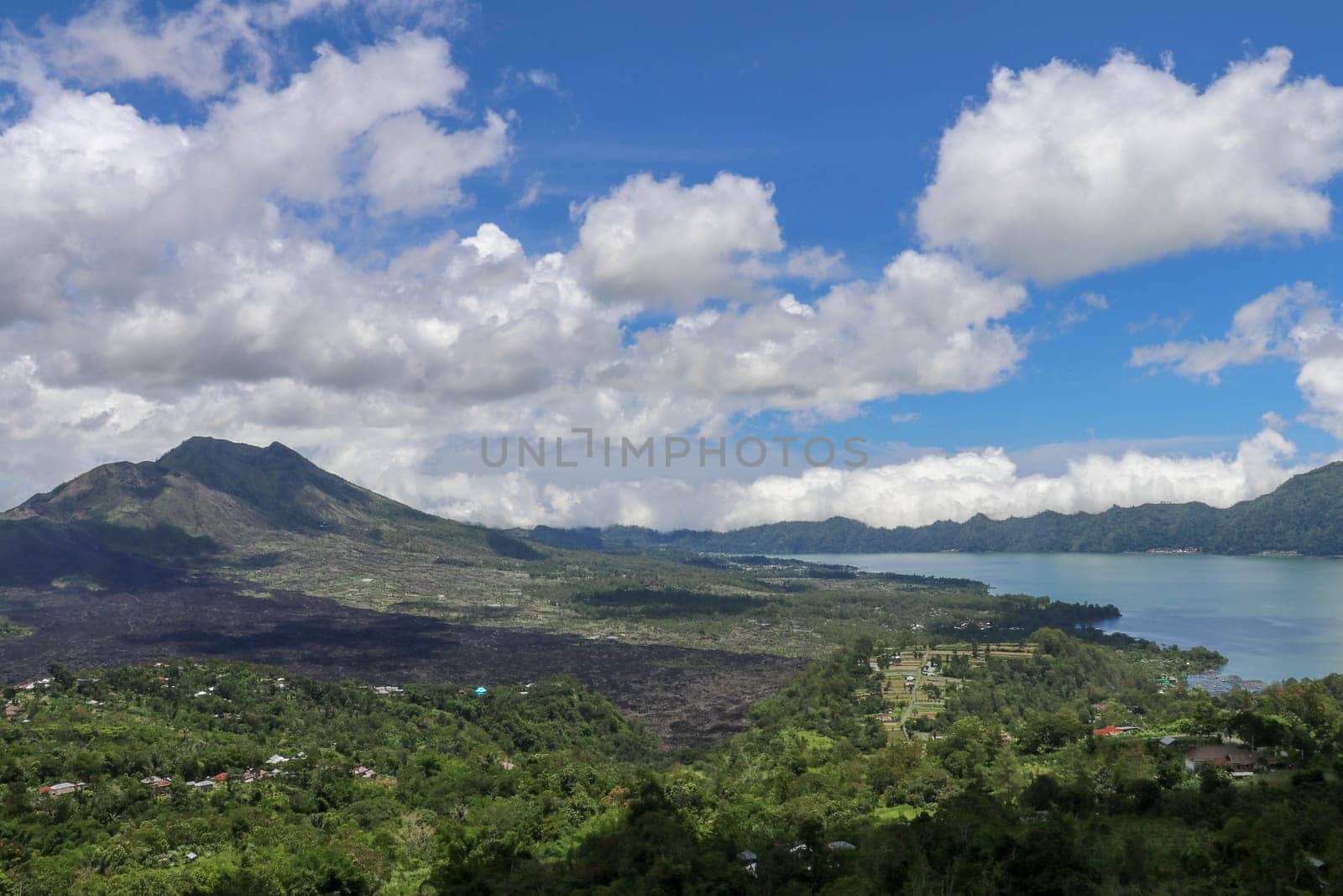 Panoramic indonesian landscape tropical island bali. Popular tourist attractions of Bali tropical island, amazing top view on Batur Indonesia. Batur lake and volcano are in the central mountains.