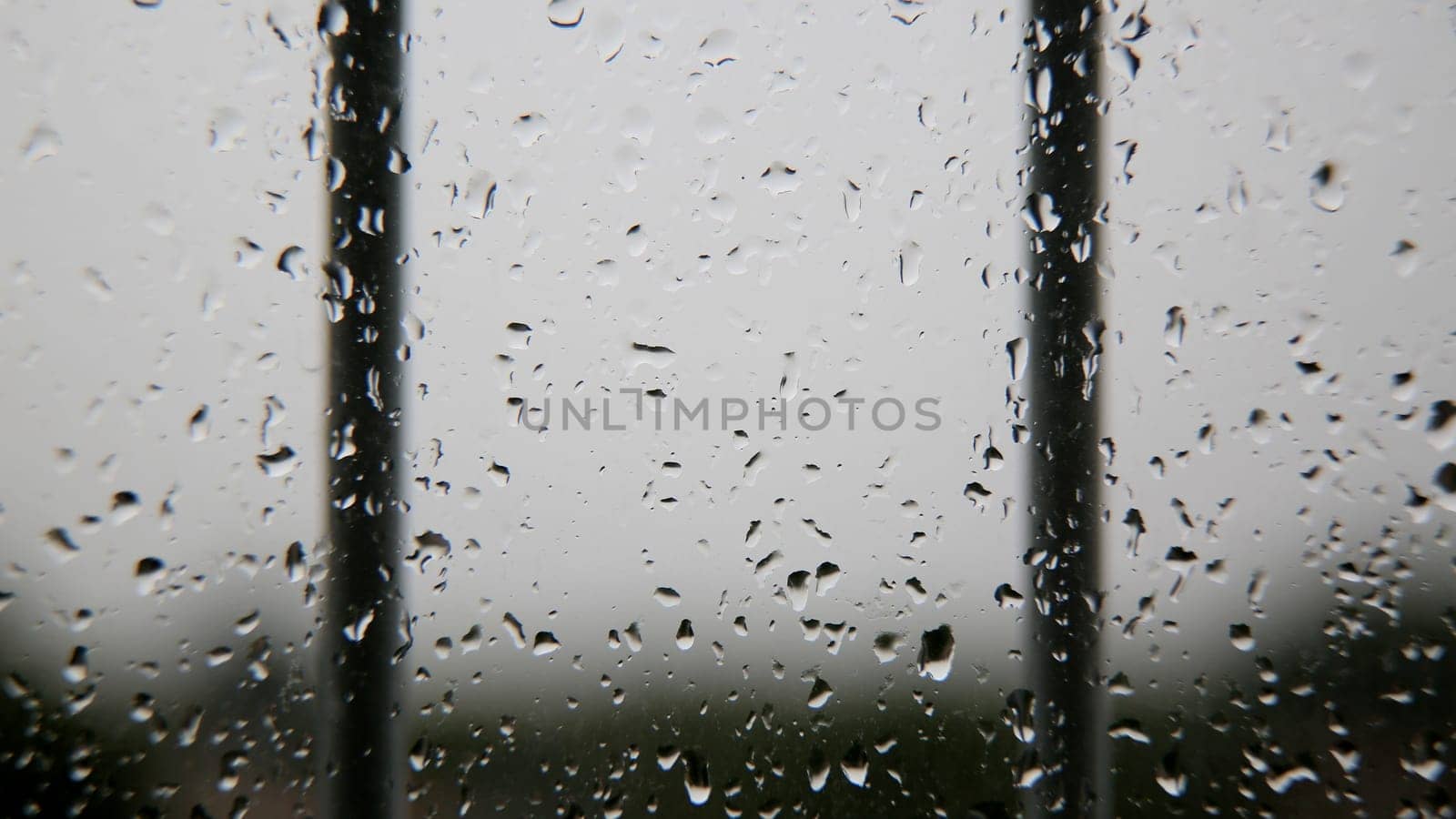 salvador, bahia / brazil - july 7, 2020: raindrops of water are seen coming down from an apartment window in the city of Salvador.