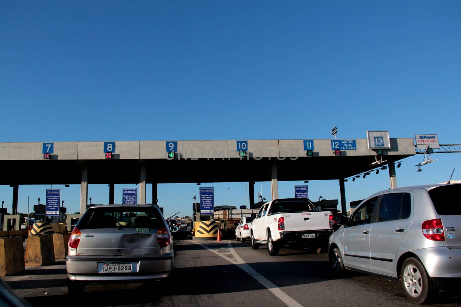 salvador, bahia / brazil - december 19, 2012: vehicles are seen in a toll plaza on highway BA 526, Cia / Aeroporto, in the city of Salvador.