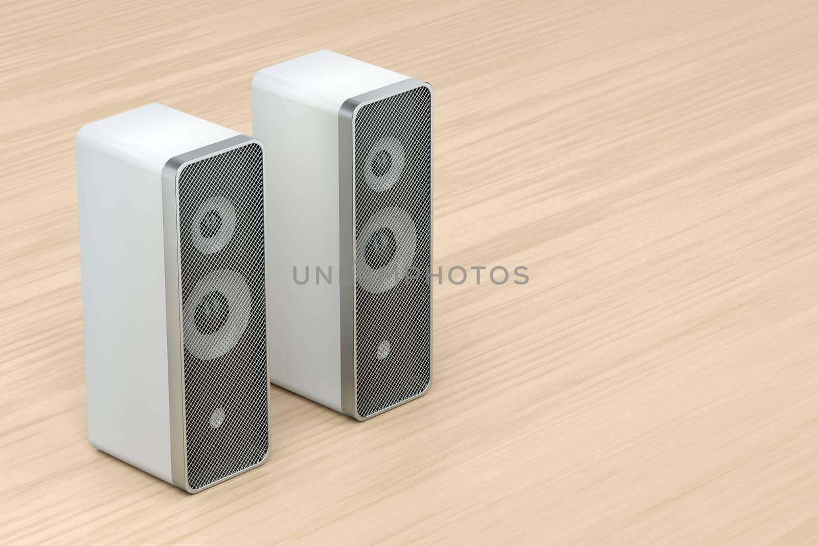 Stereo computer speakers on wooden desk