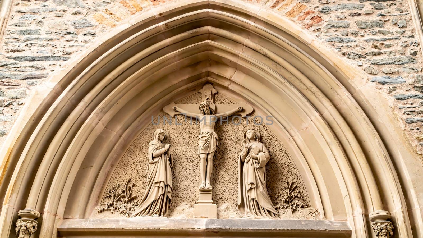 Christian church portal in detail of St. Laurentius church in Saarburg