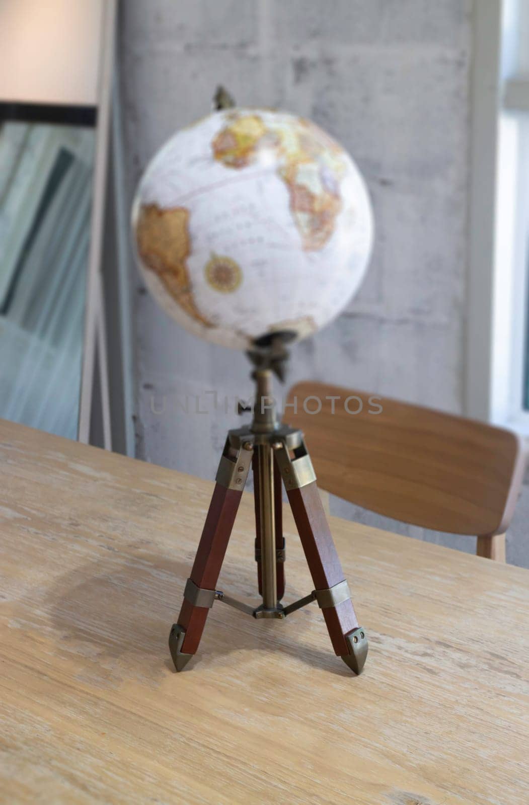 Vintage globe decorated on top of the table, stock photo