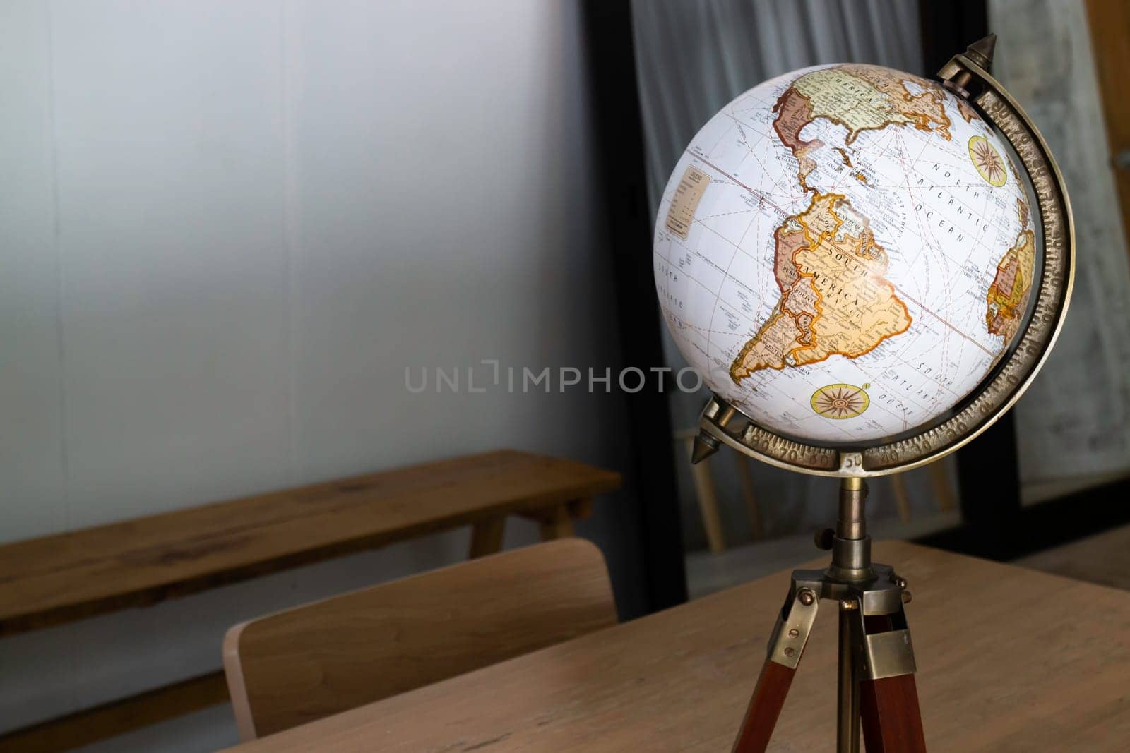 Vintage globe decorated on top of the table, stock photo
