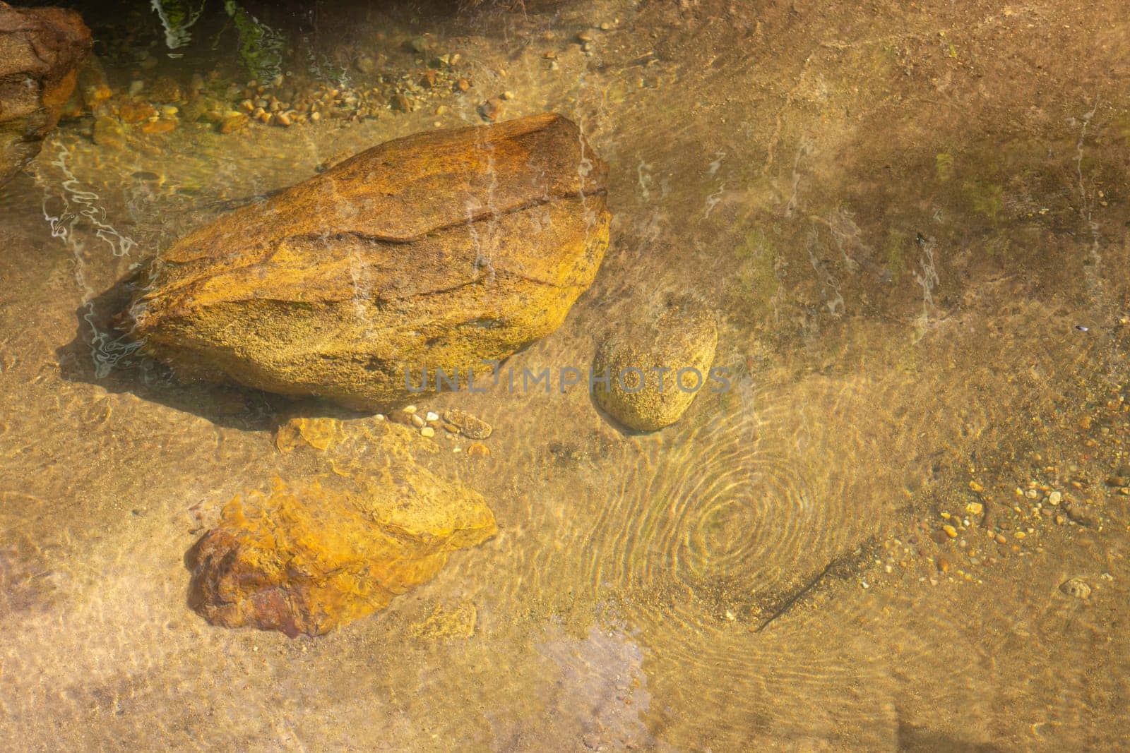 The photo through the water layer on the underground