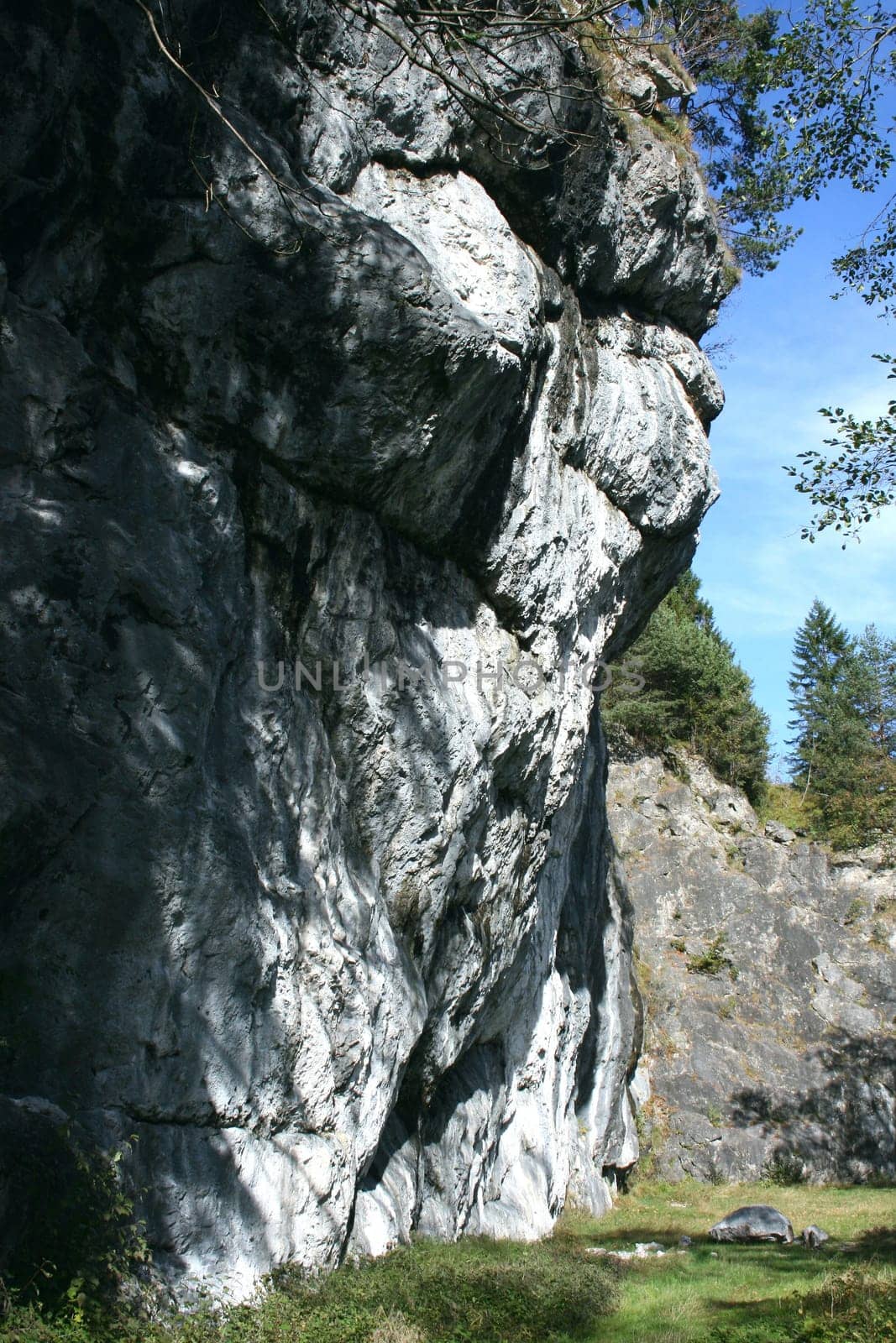 A landscape in the highlands, with rocks, trees and blue sky