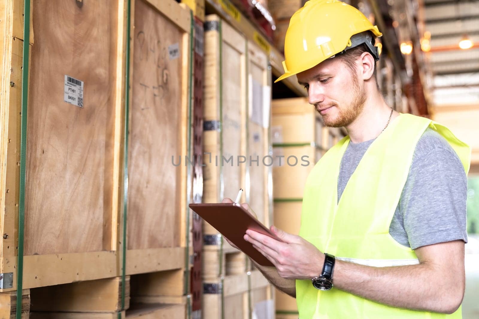 Portrait white caucasian warehouse worker use digital tablet working with inventory check in large warehouse distribution center. Reopening  Business warehouse technology and logistic concept
