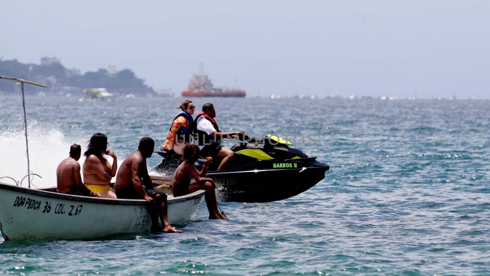 salvador, bahia / brazil - january 1, 2015: watercraft - jet sky - is seen sailing together with bathers on Boa Viagem beach in the city of Salvador.