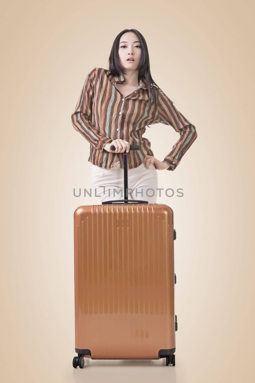 Modern Asian woman stand with a luggage.