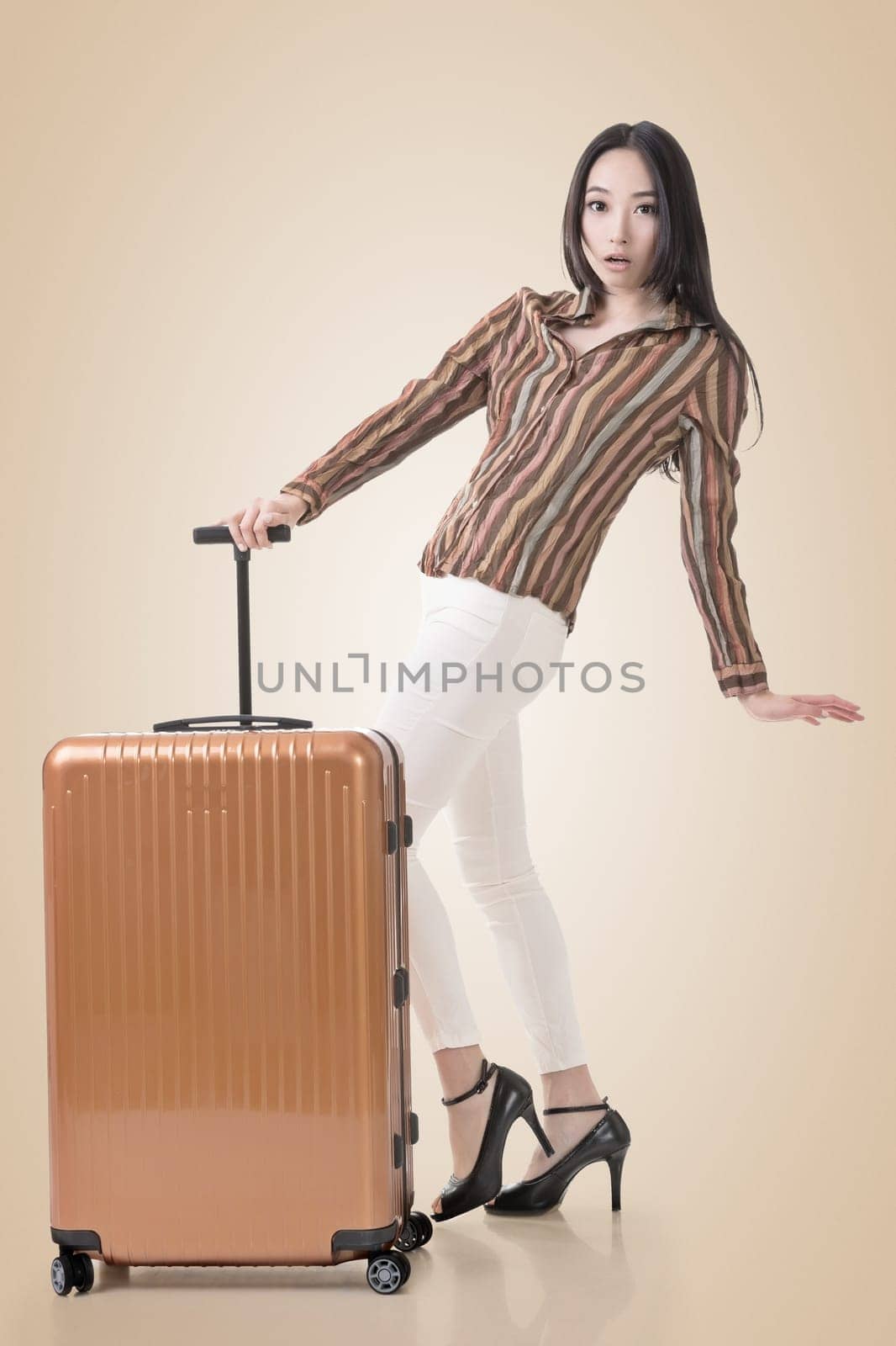 Modern Asian woman stand with a luggage.