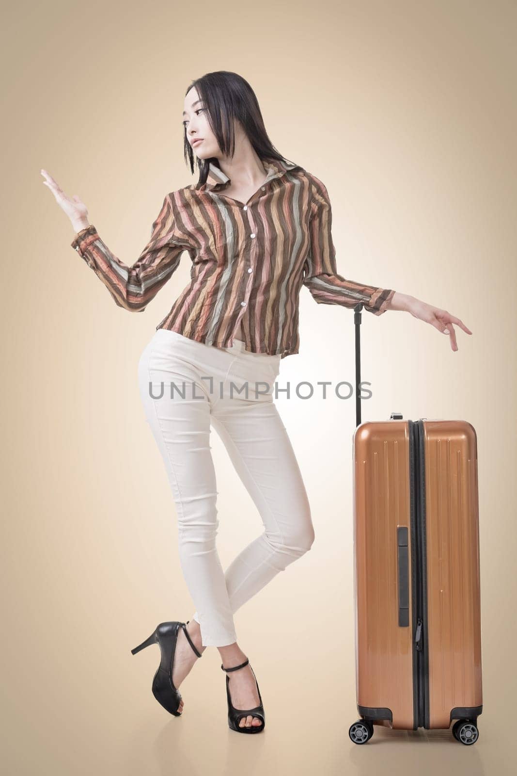 Modern Asian woman stand with a luggage in vintage style.