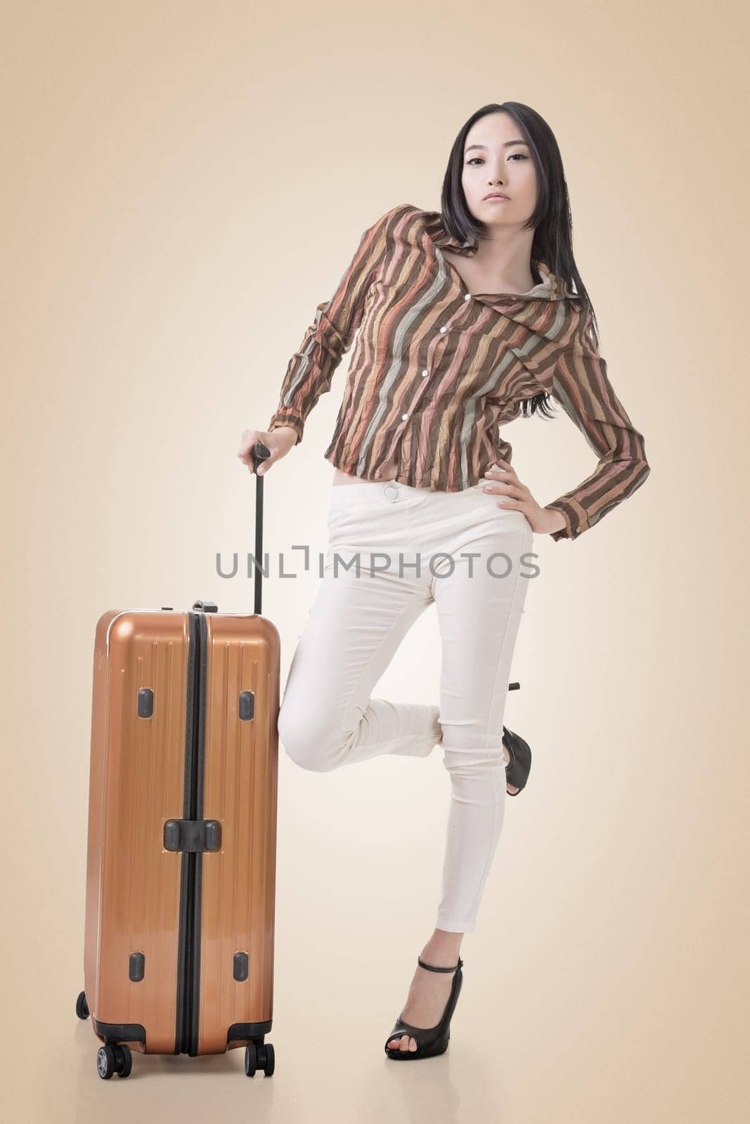 Modern Asian woman stand with a luggage in vintage style.