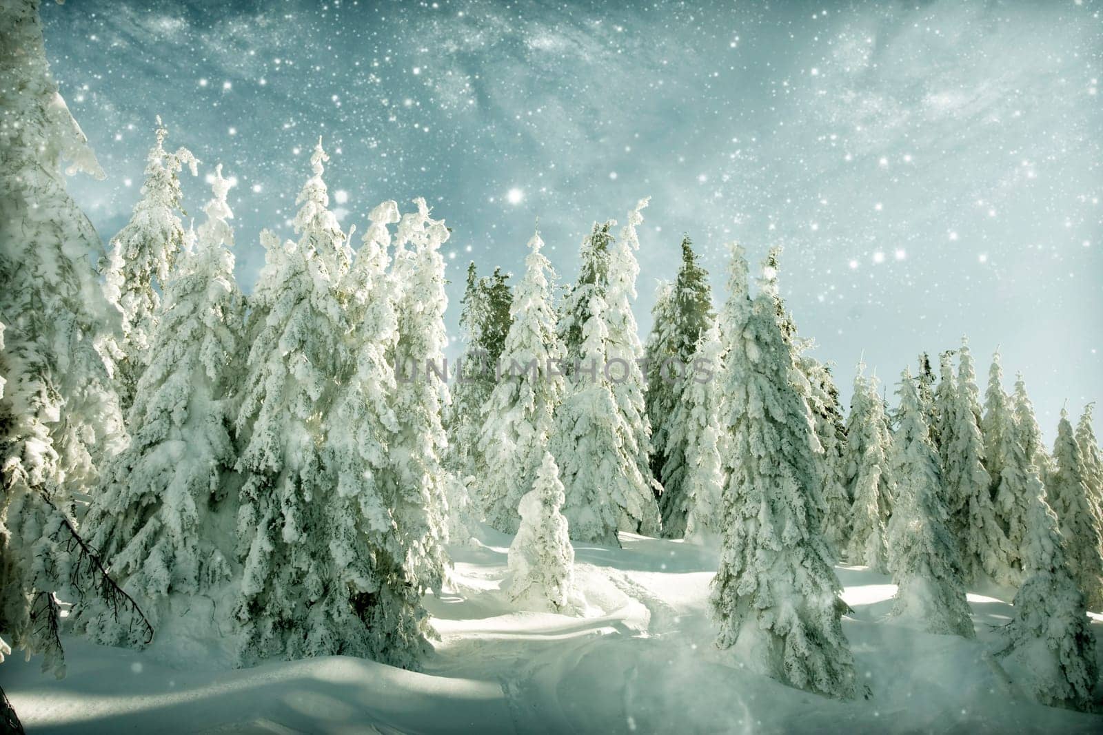 Winter landscape with snow covered hill and cloudy blue sky
