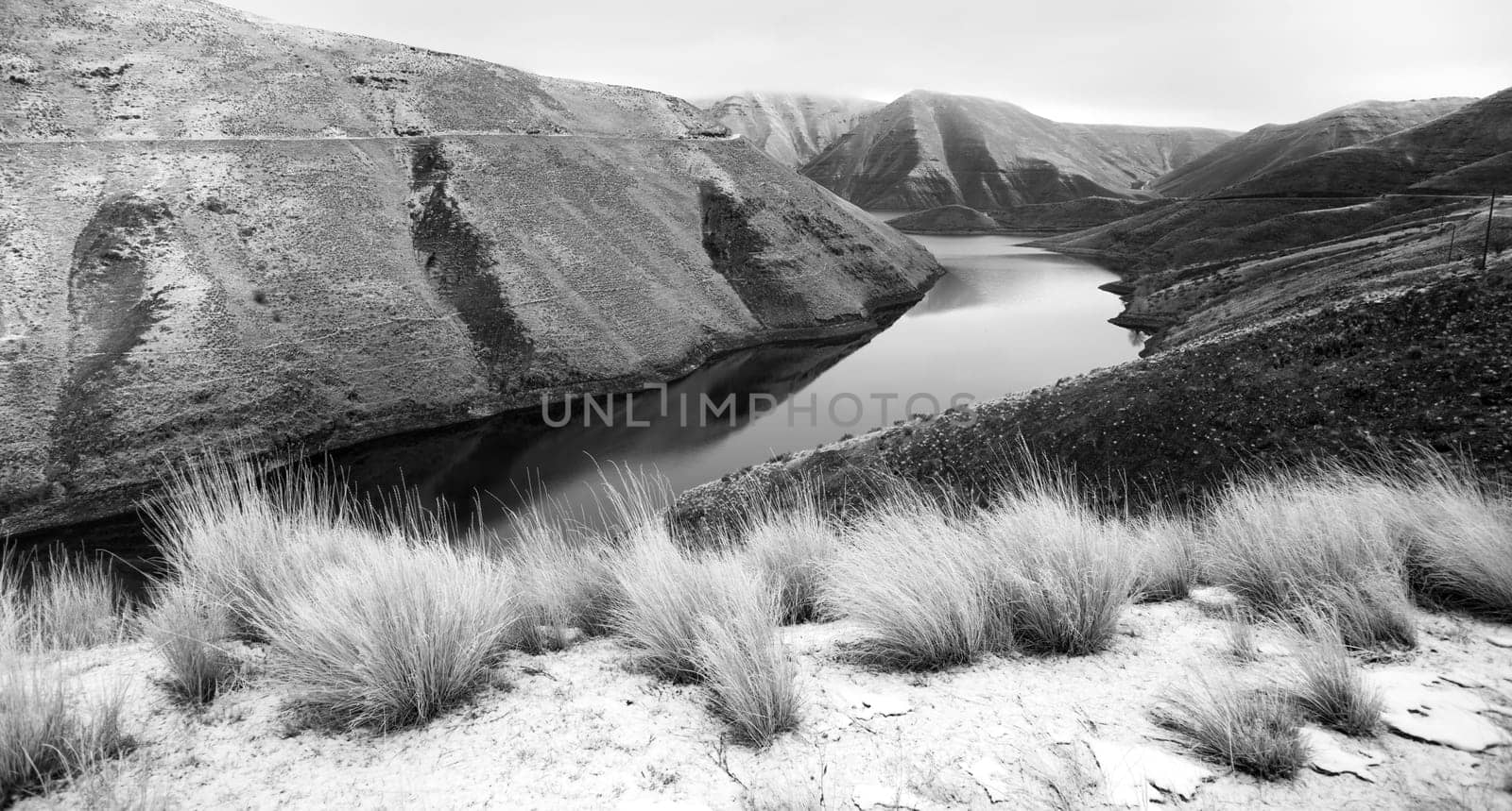 The road overlooks a weathered and historic landscape in the winter Oregon Landscape