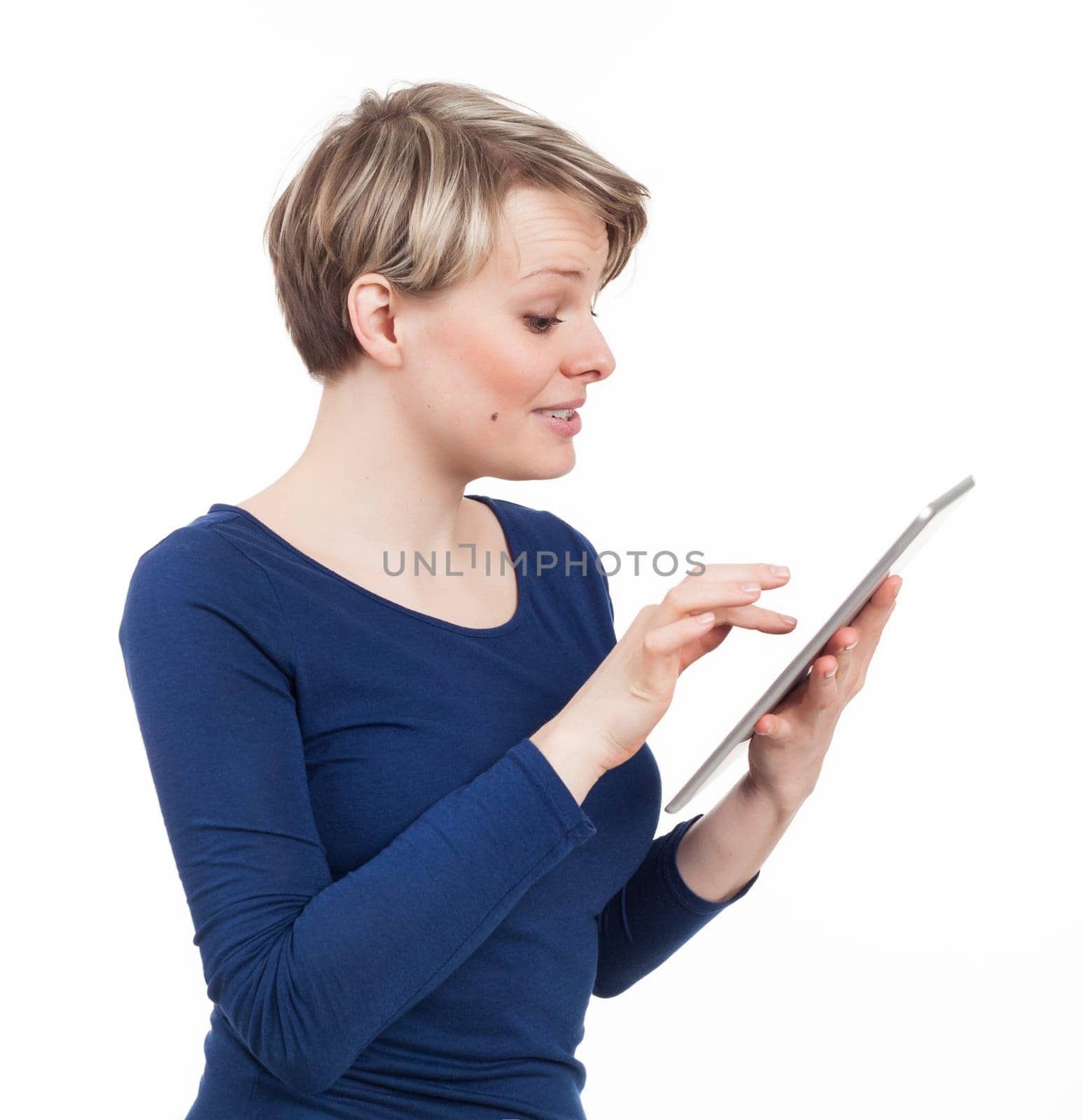 Young female using an electronic tablet, isolated on white