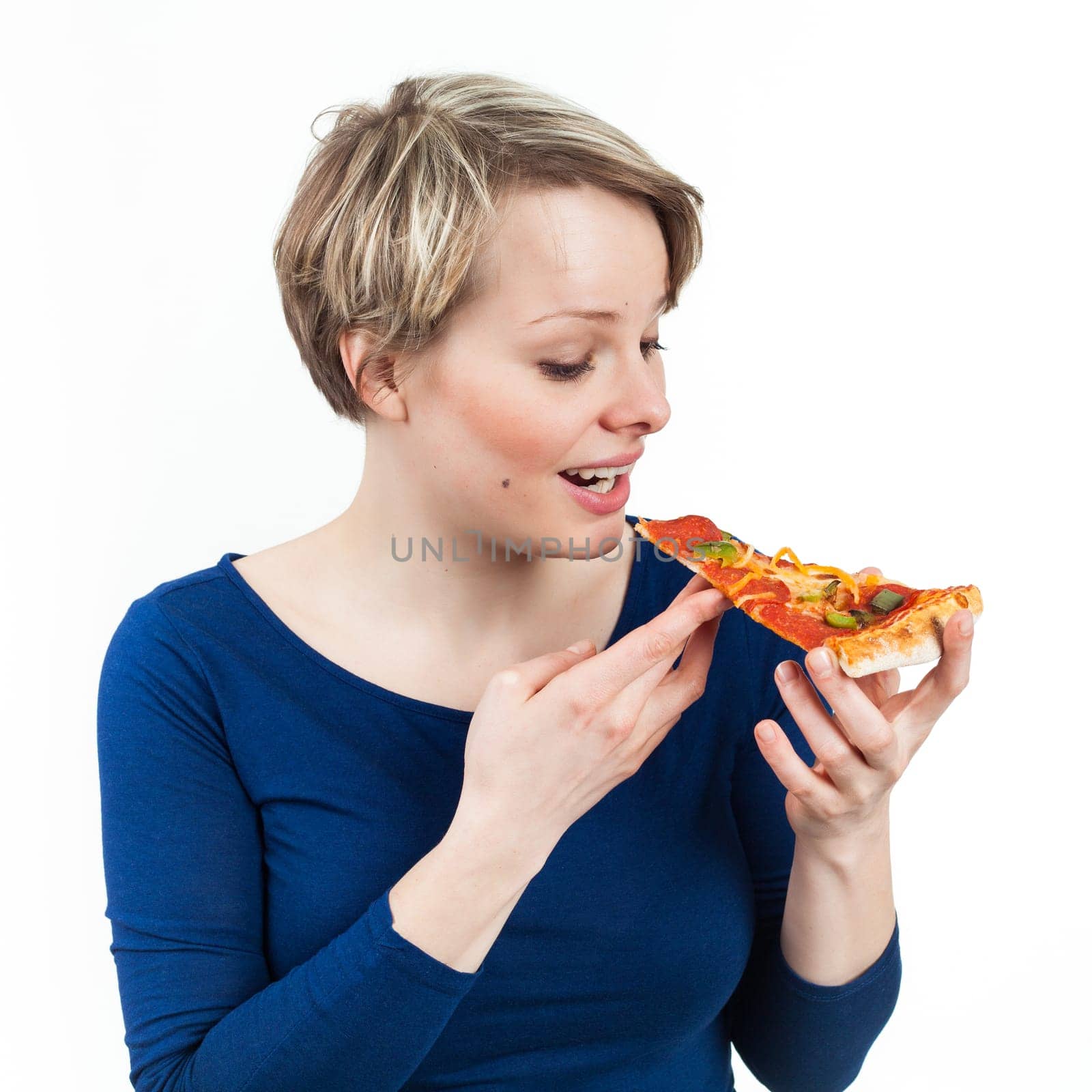 Young woman holding a slice of pizza, isolated on white