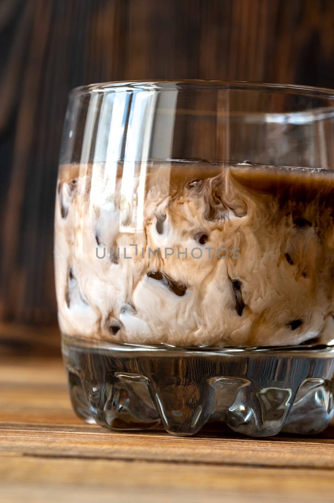 Glass of White Russian cocktail. Combining vodka, coffee liqueur and cream.