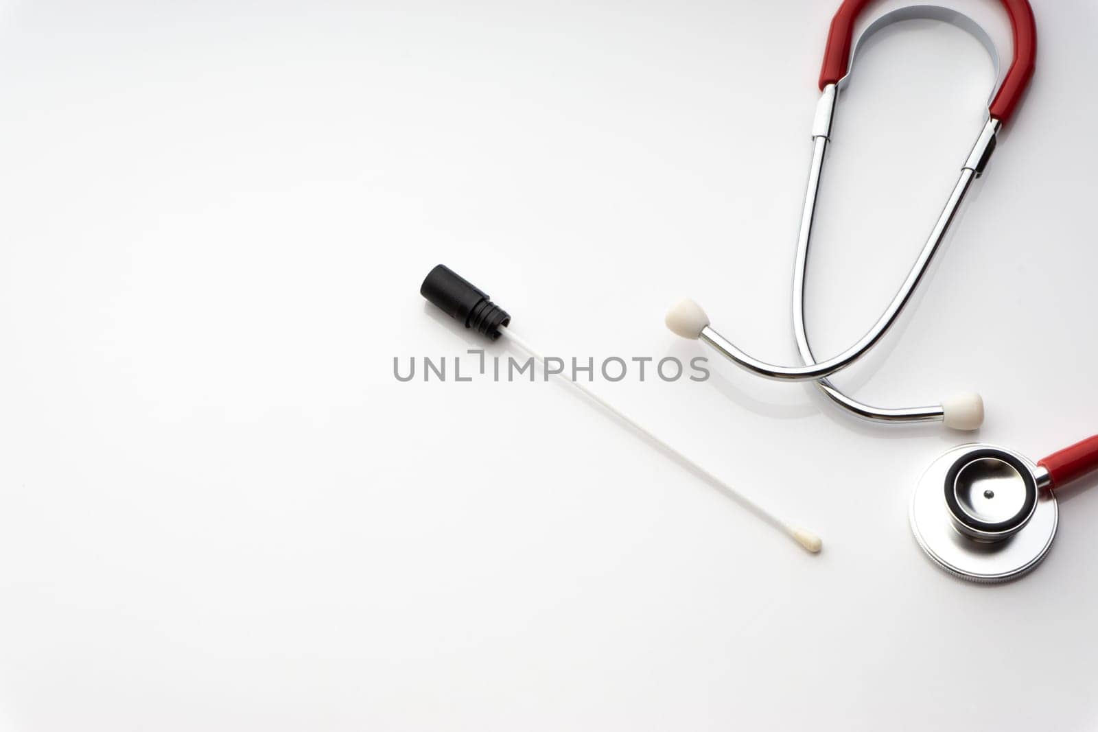 Medical swab and stethoscope on white background. Healthcare dan Copy Space concept