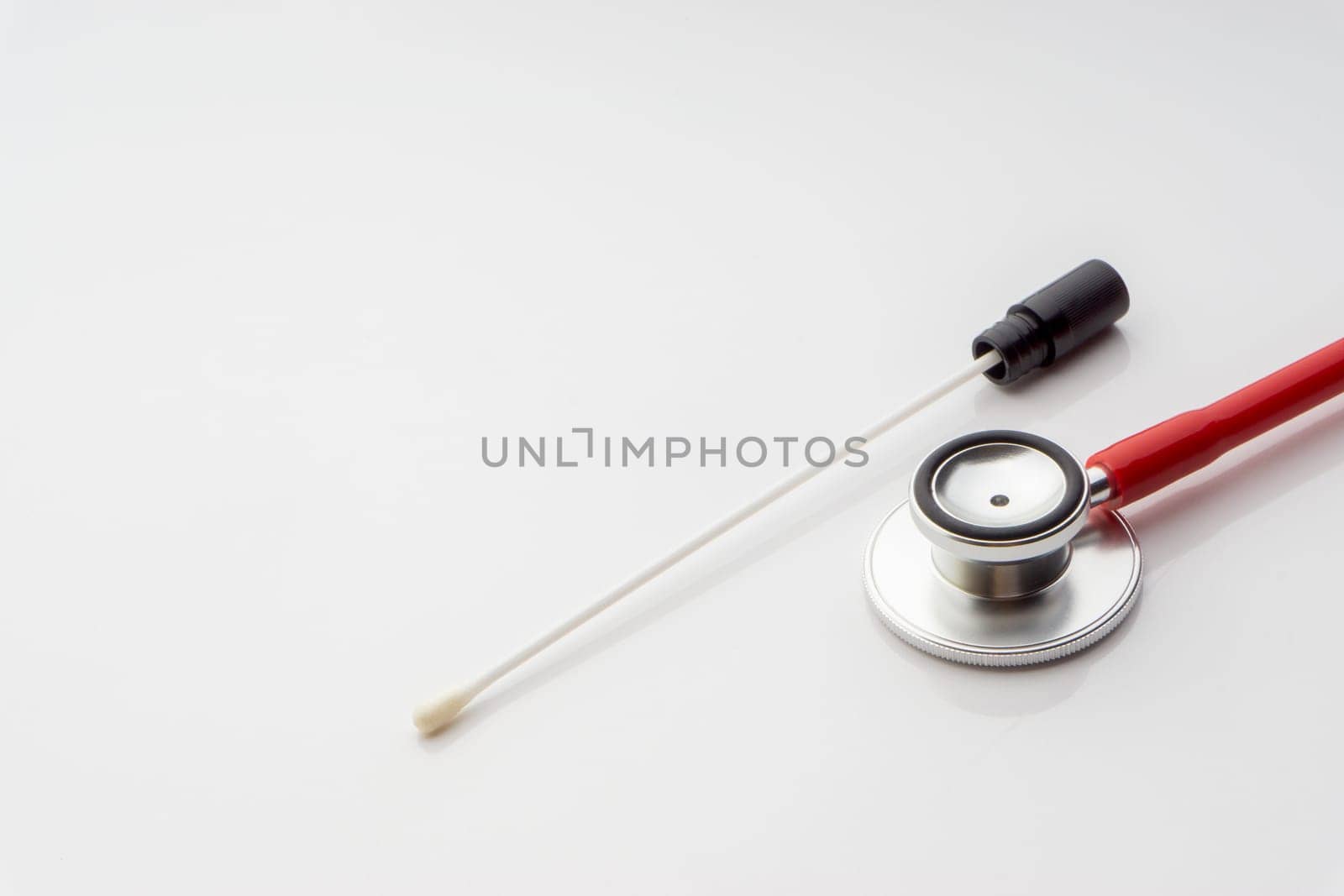 Medical swab and stethoscope on white background. Healthcare dan Copy Space concept