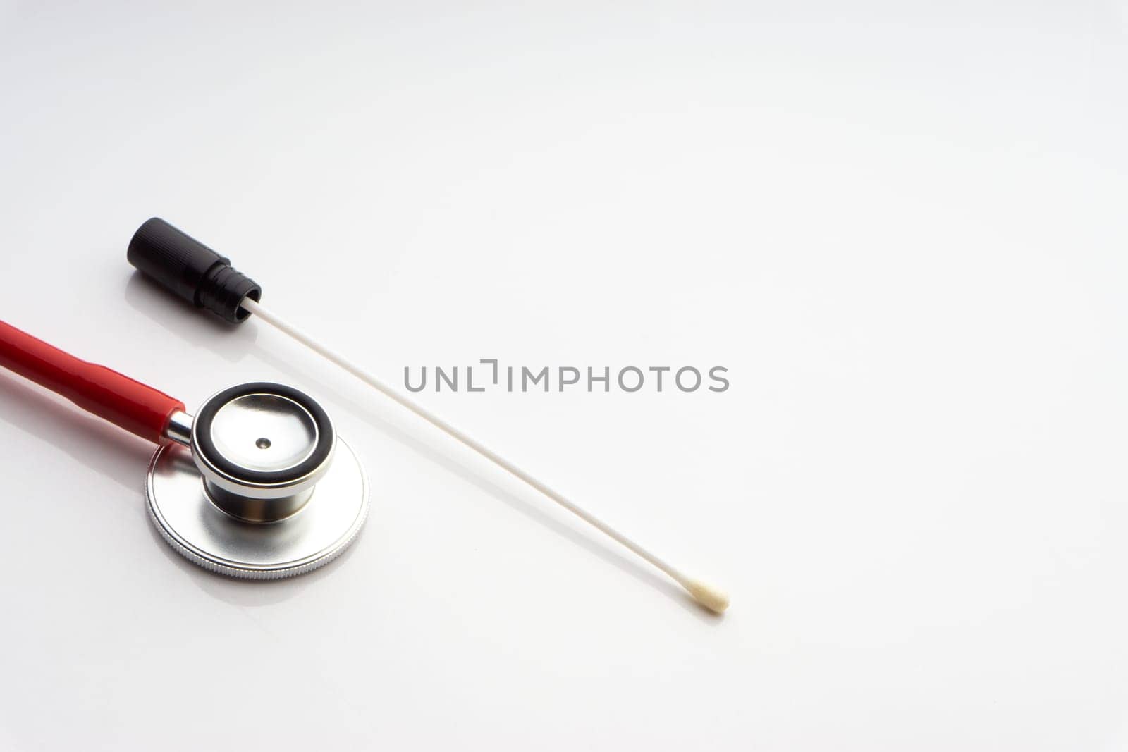 Medical swab and stethoscope on white background. Healthcare dan Copy Space concept