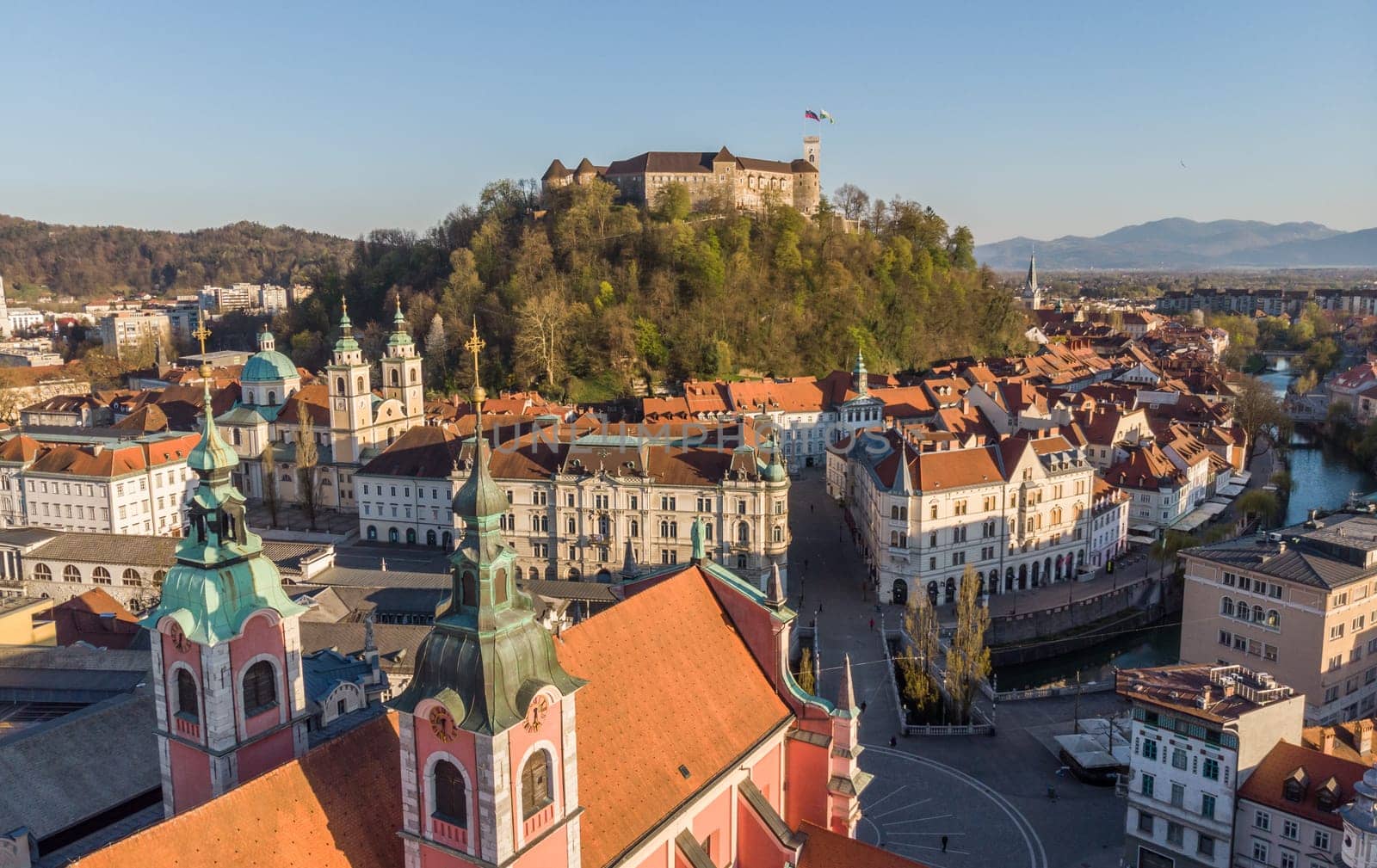 Aerial drone panoramic view of Ljubljana, capital of Slovenia in warm afternoon sun.