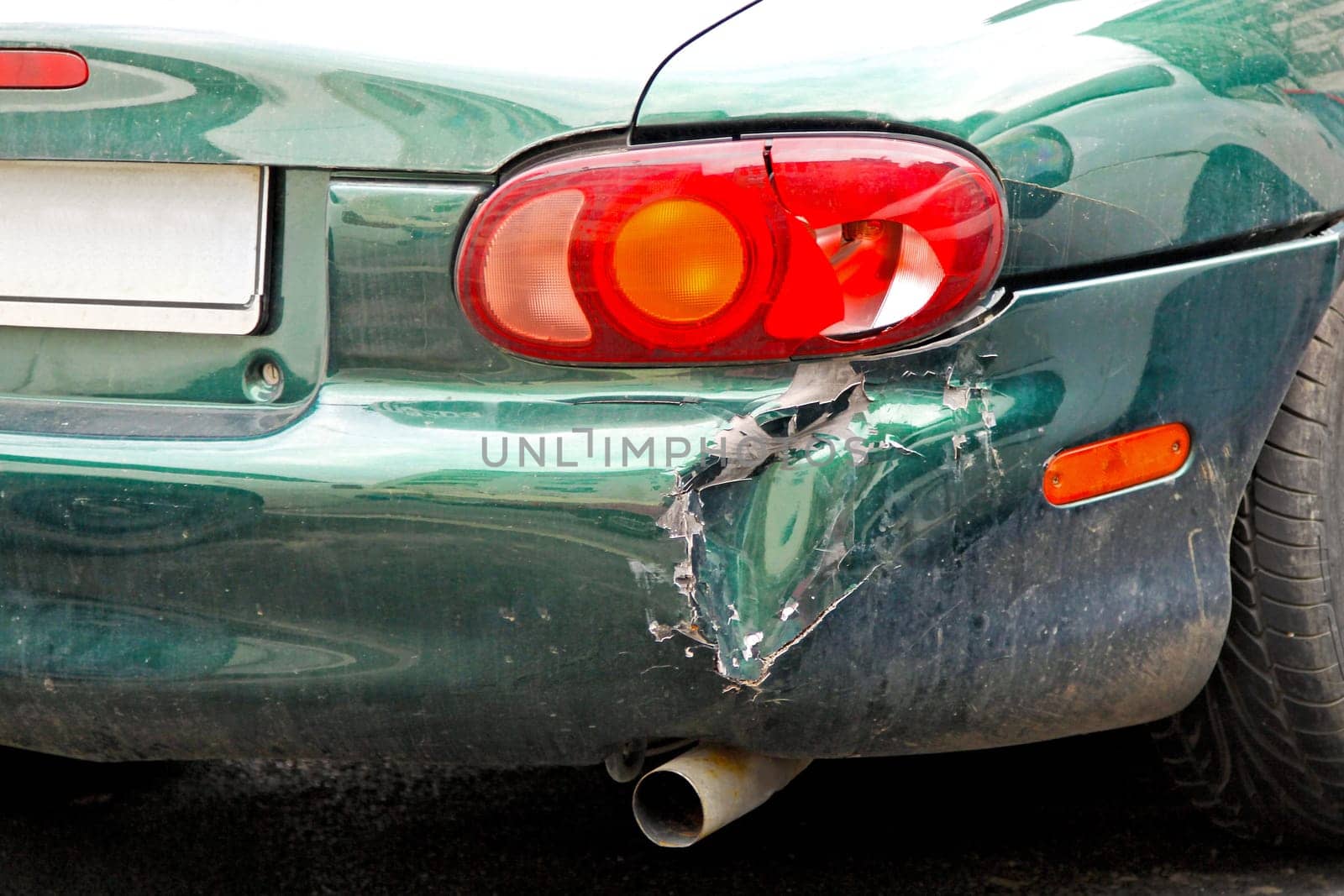 Close up shot of crashed car bumper.
