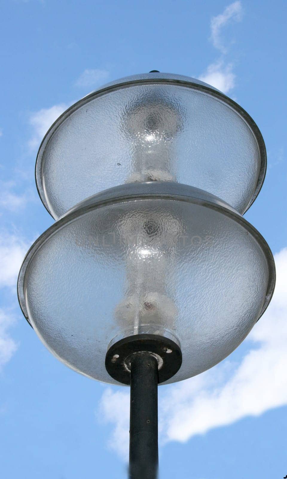 a street lamp with a two, spherical glass bodys