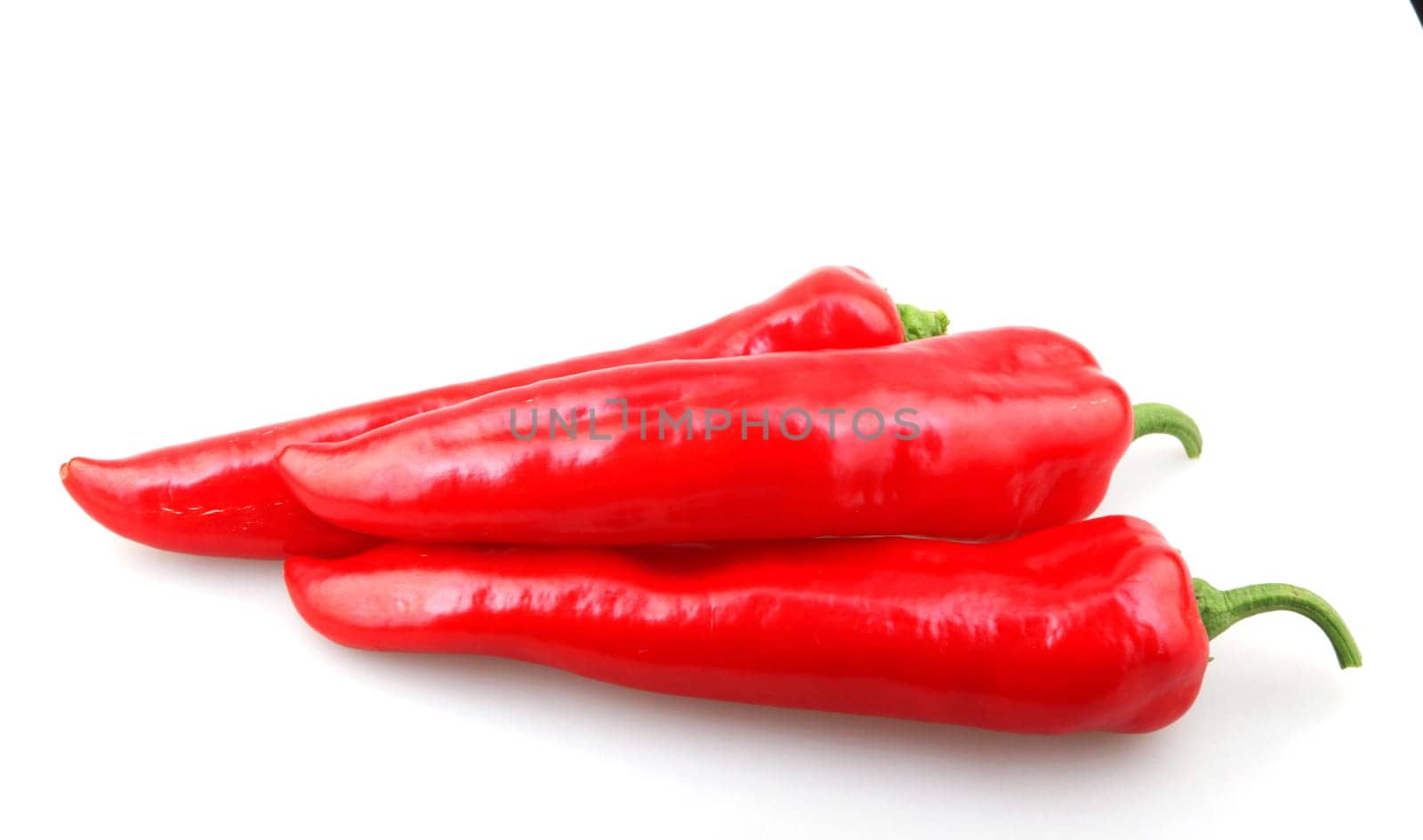 Close-Up Of Red Chili Pepper Against White Background