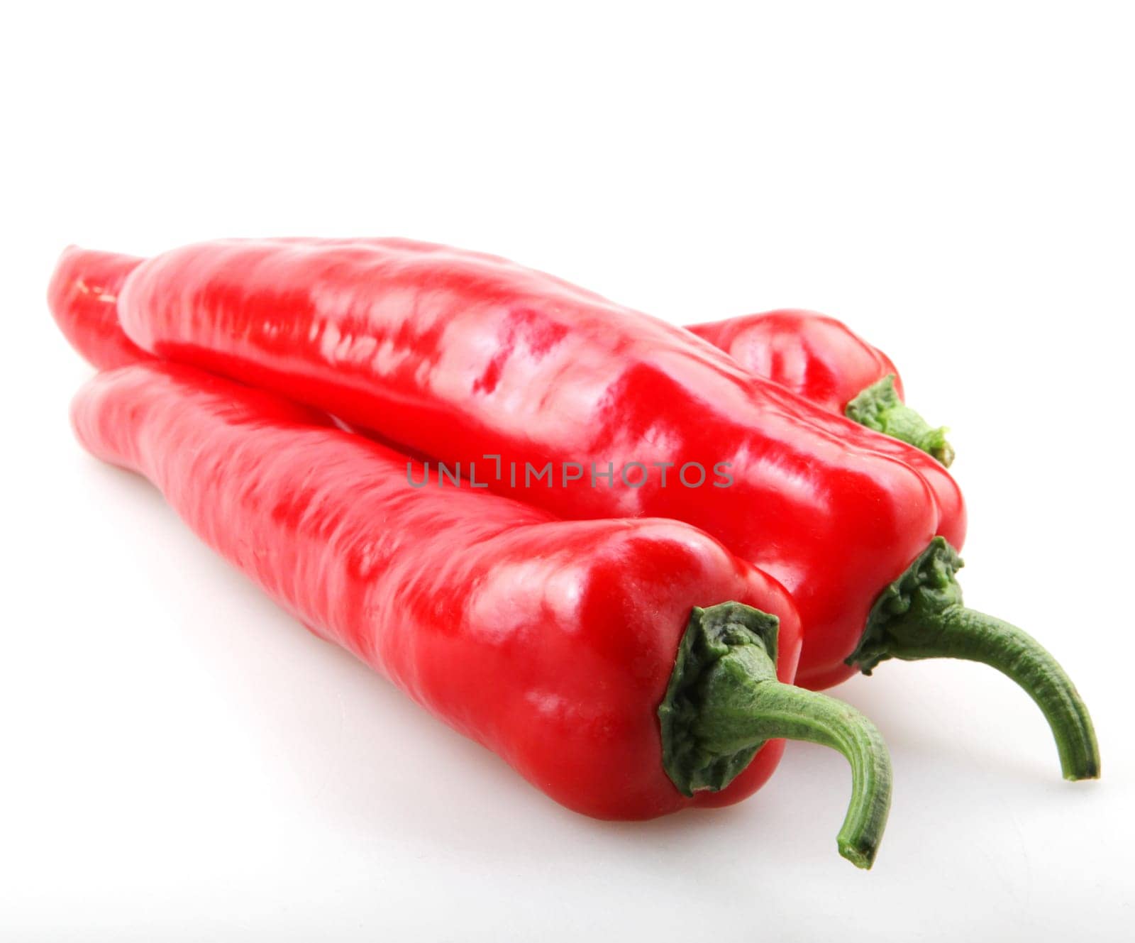 Close-Up Of Red Chili Pepper Against White Background