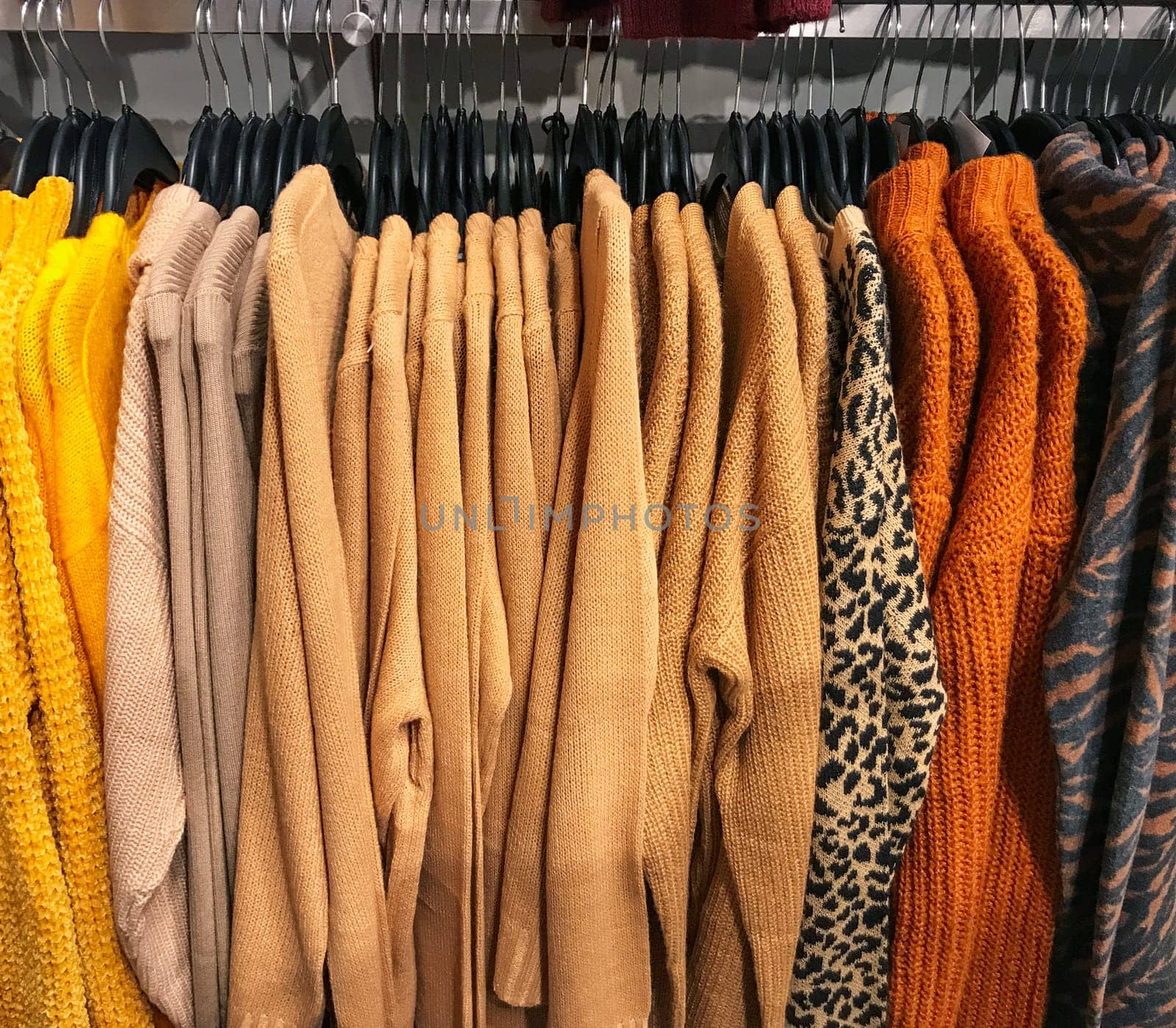 Different types of winter sweaters for sale at a nearby store