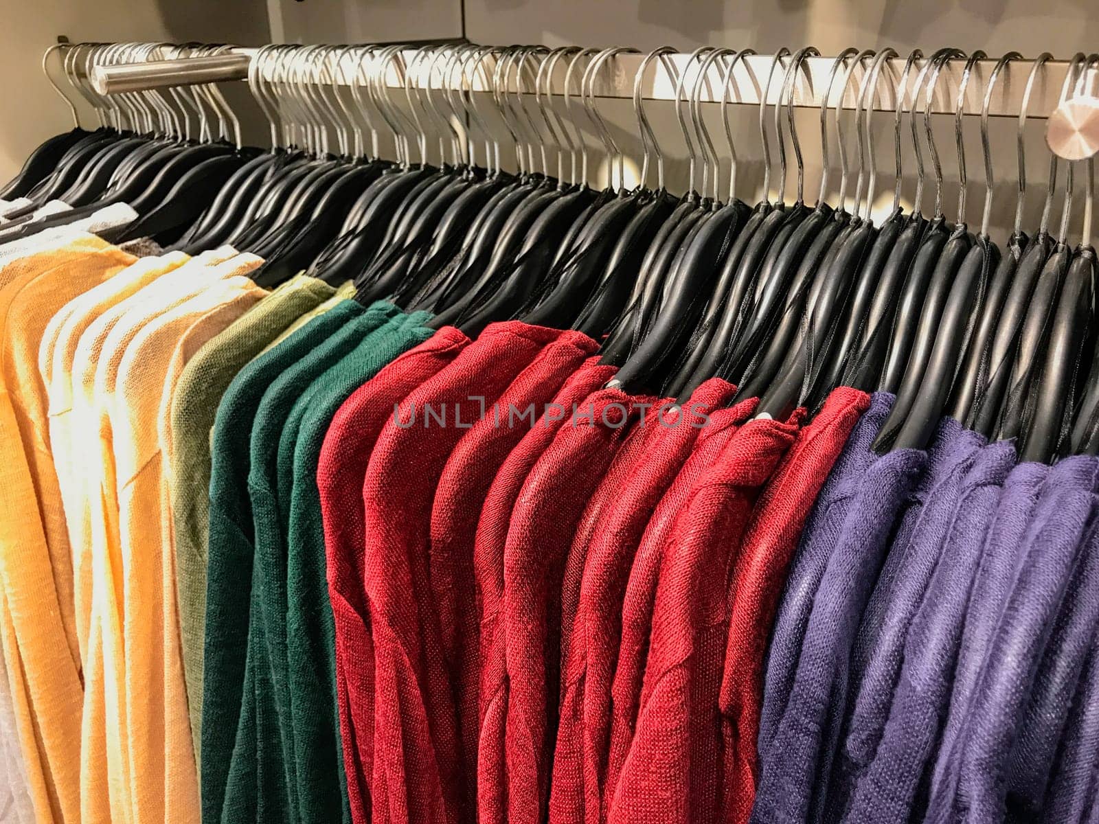 Different types of winter sweaters for sale at a nearby store