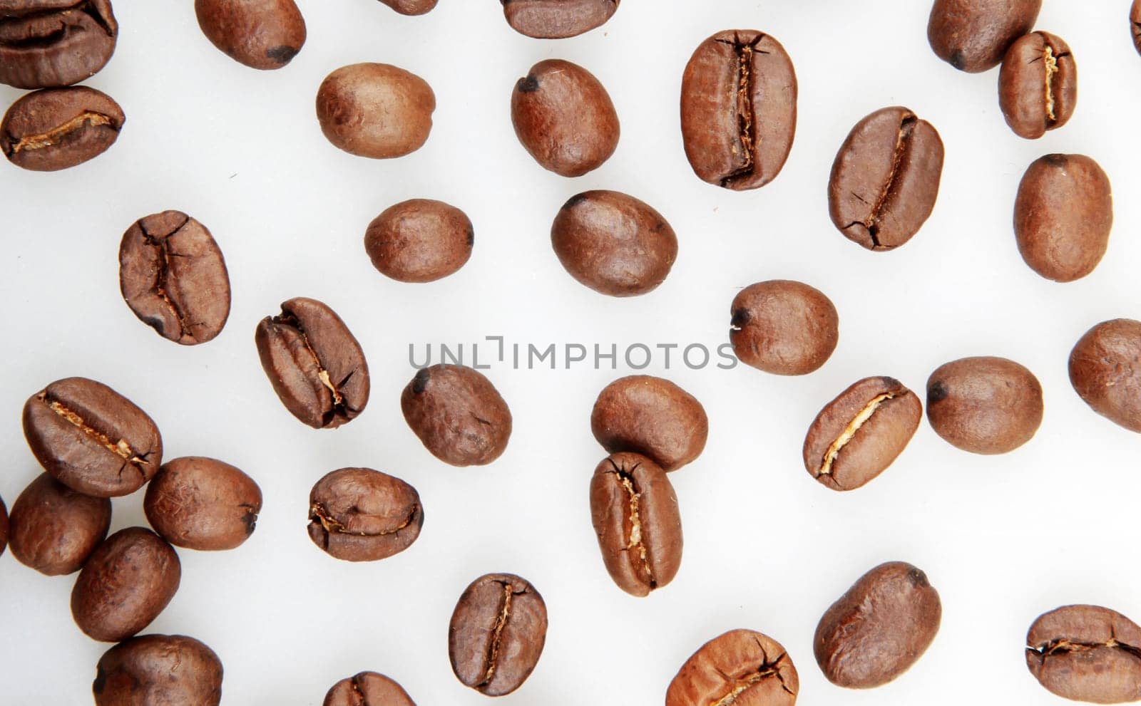 Fresh Roasted Coffee Beans Isolated On White Background