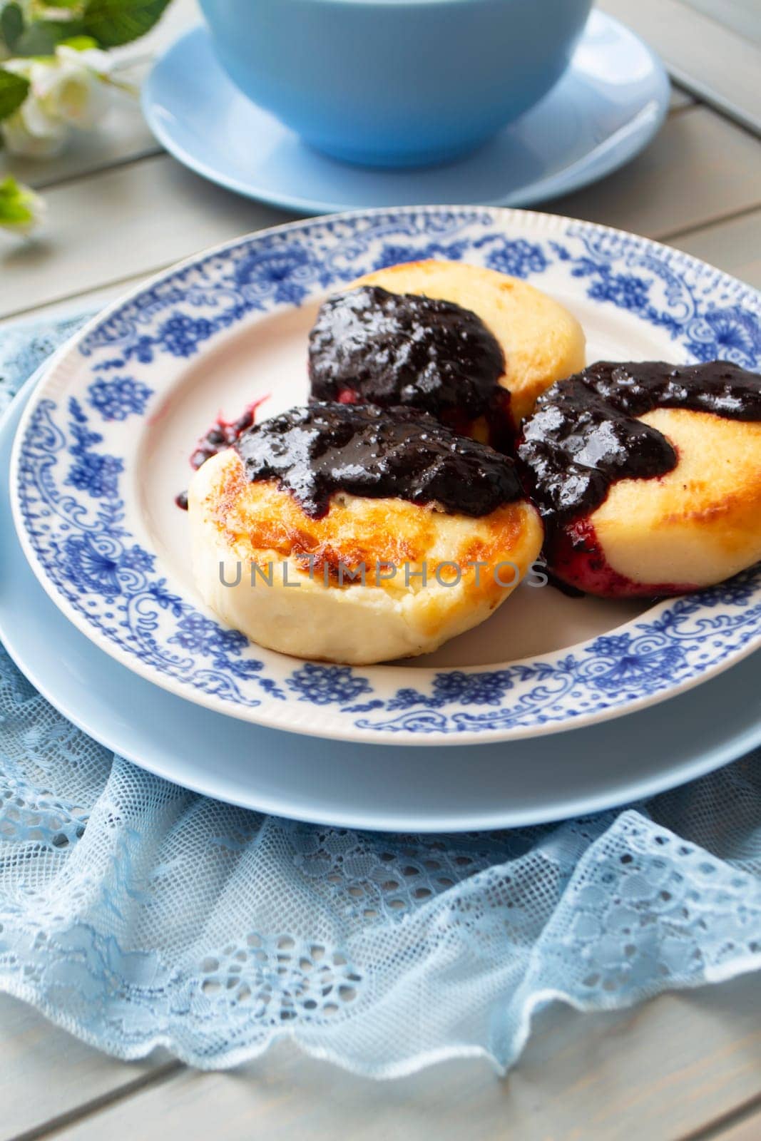 Cottage cheese pancakes, syrniki, Healthy and delicious morning breakfast. Vertical image