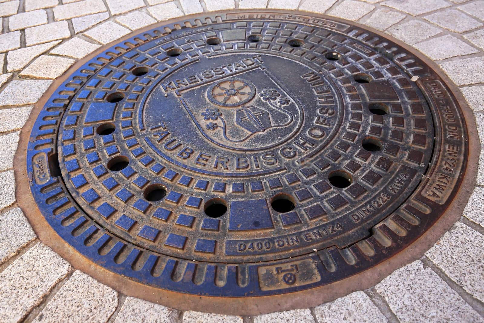 Tauberbischofsheim, Baden-Württemberg / Germany - 13 05 2019: Manhole cover of Tauberbischofsheim with coat of arms