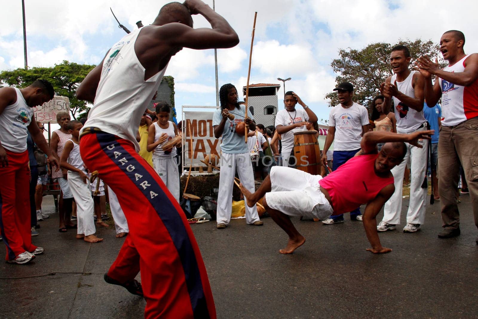 salvador, bahia / brazil - july 2, 2013: capoeiristas are seen during a presentation at the Bahia independence parade in Lapinha neighborhood in the city of Salvador...